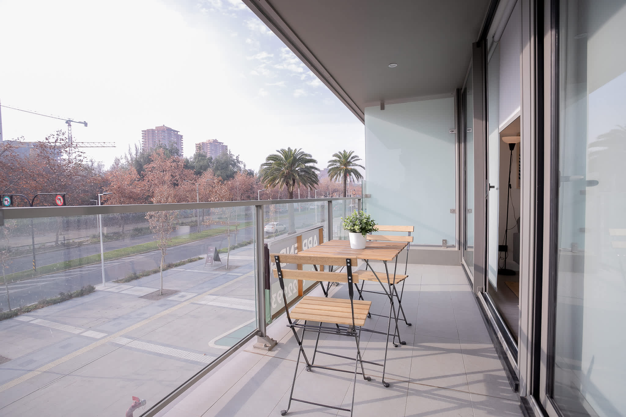 Relax on your private balcony with stunning city views and enjoy the serene atmosphere of this cozy outdoor space.