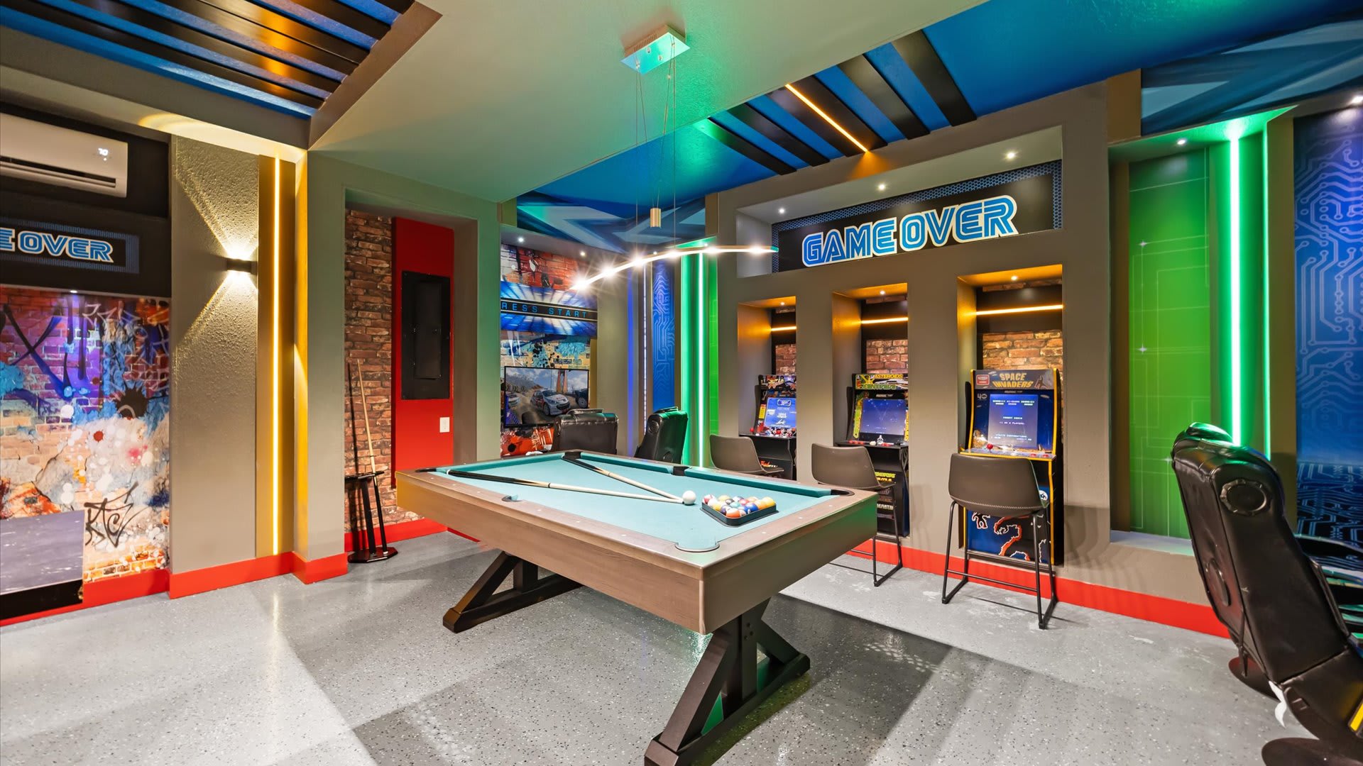 Games room with arcade games and billiards table