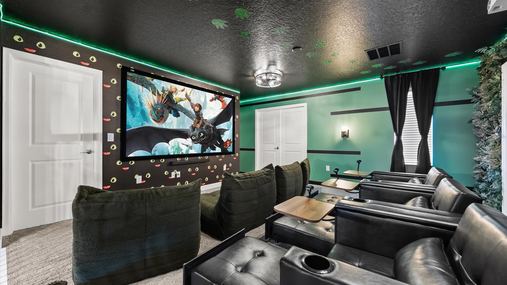 In-home cinema with large projector screen and tired seating