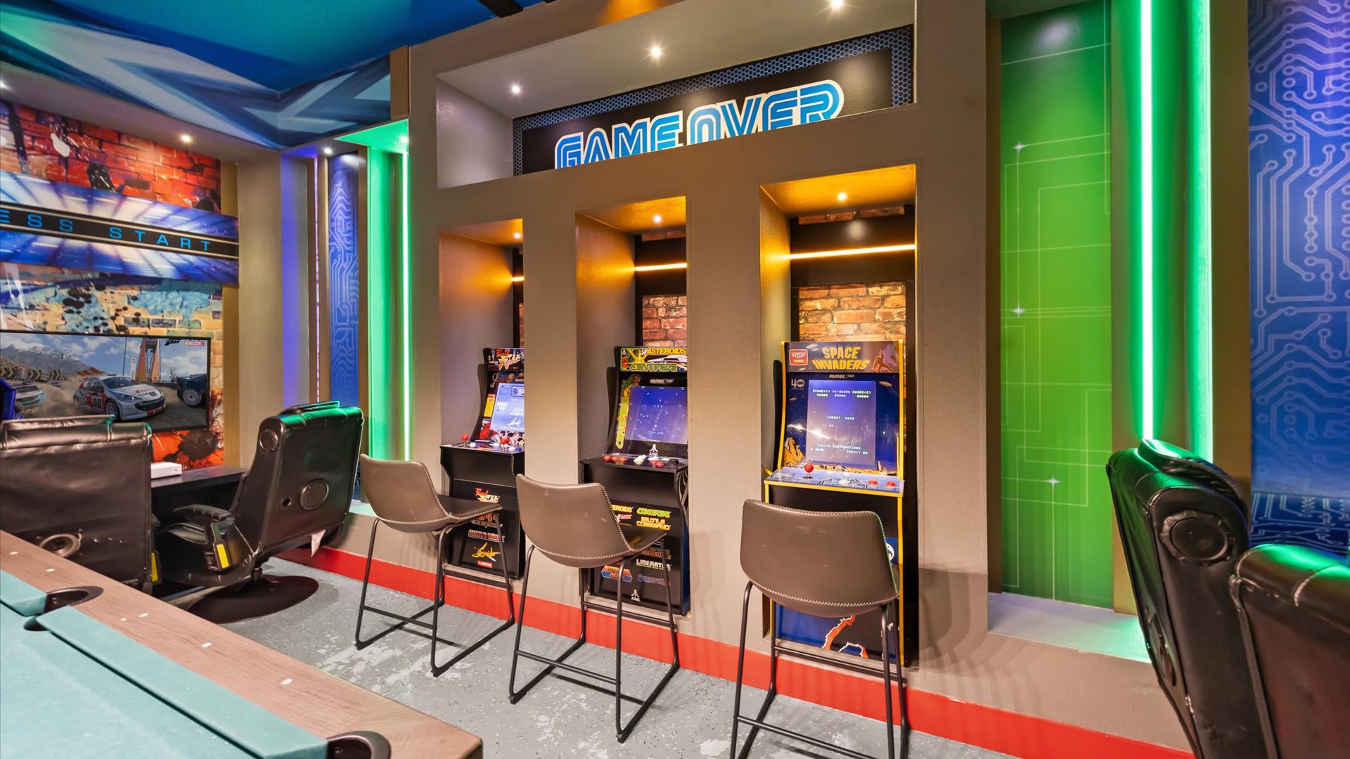 Games room with arcade games and billiards table