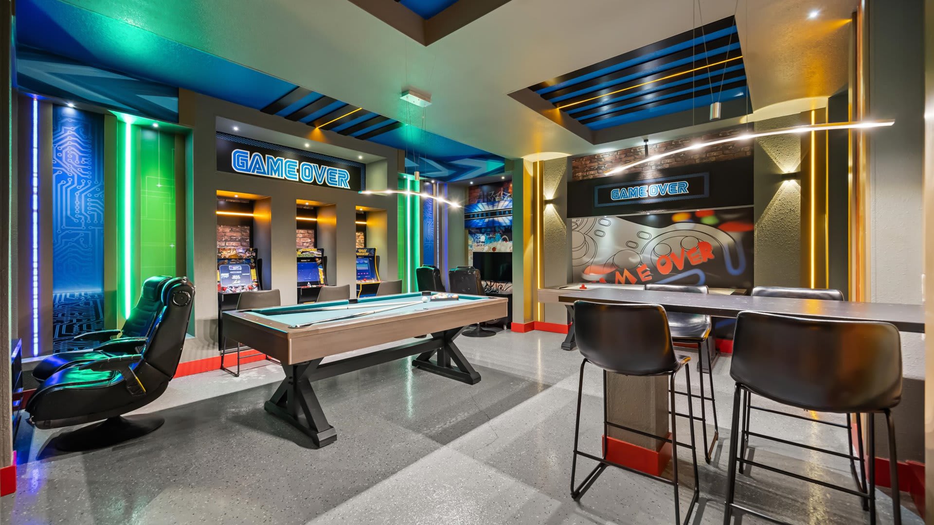 Games room with arcade games and billiards table