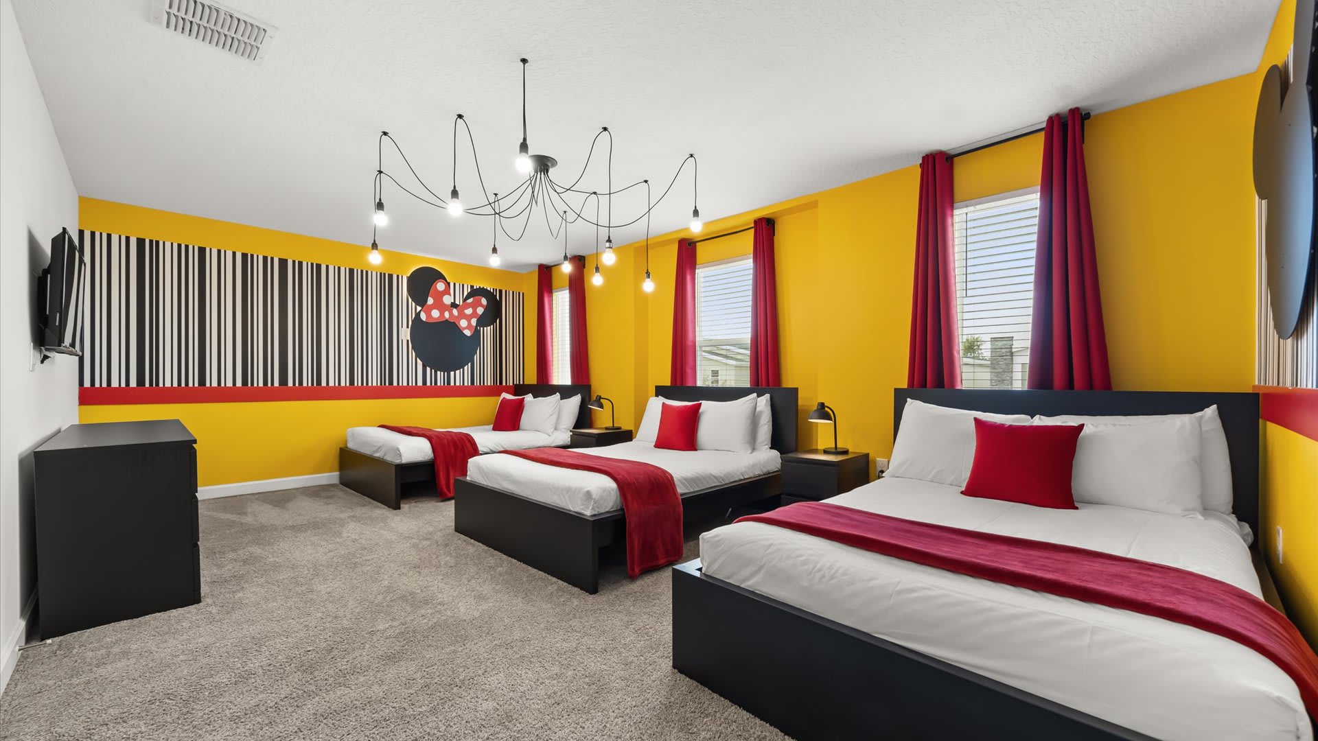 Mickey Mouse-themed bedroom with 3 double beds