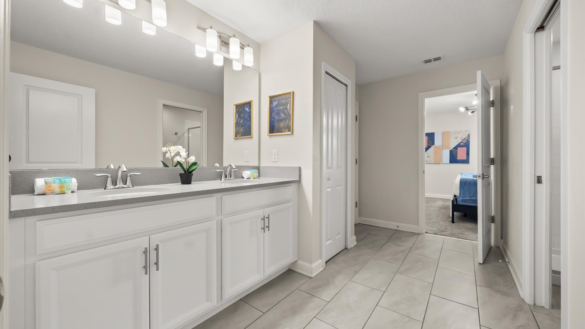 En-suite bathroom with double vanity and spacious shower 