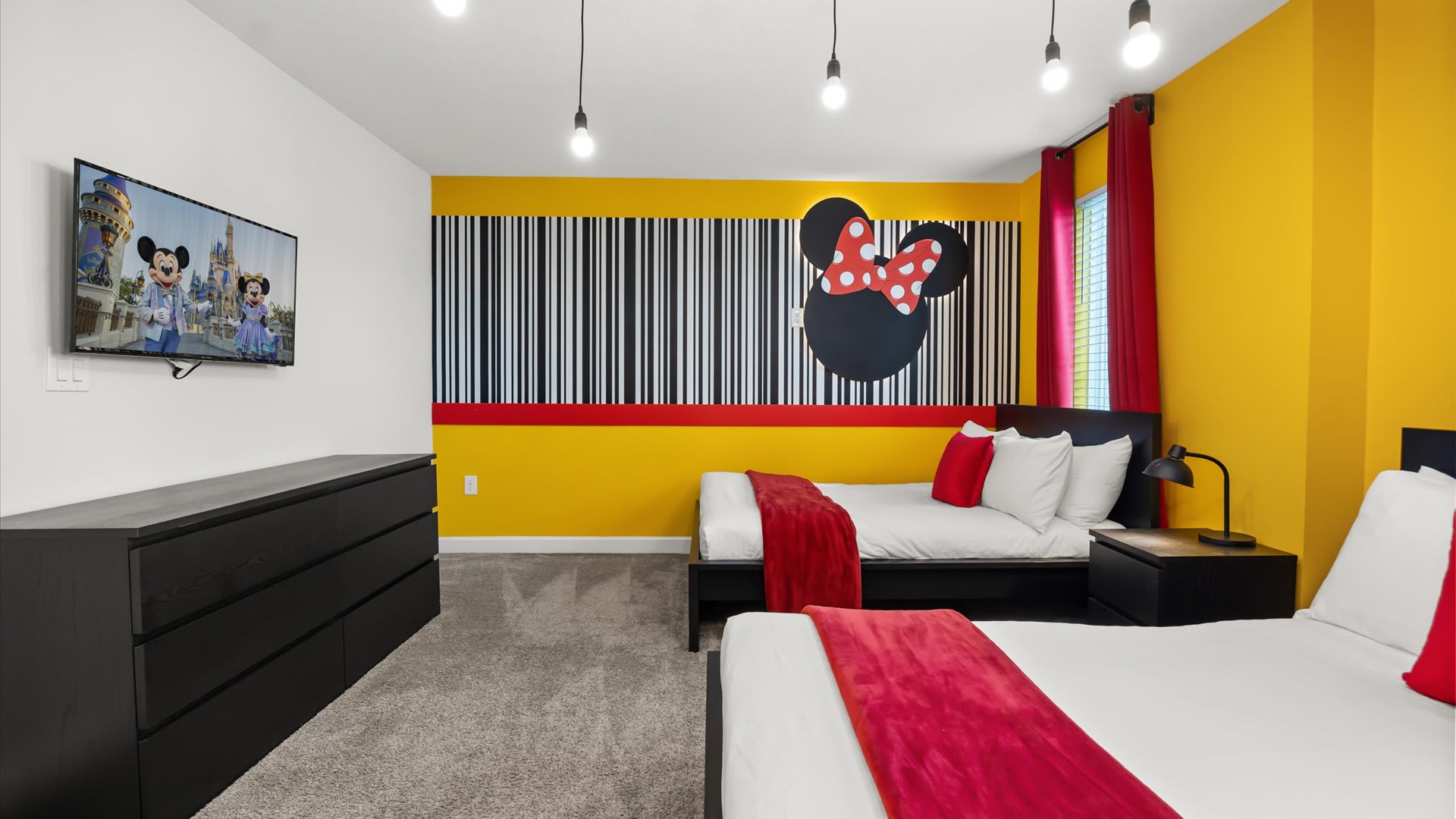 Mickey Mouse-themed bedroom with 3 double beds and smart TV