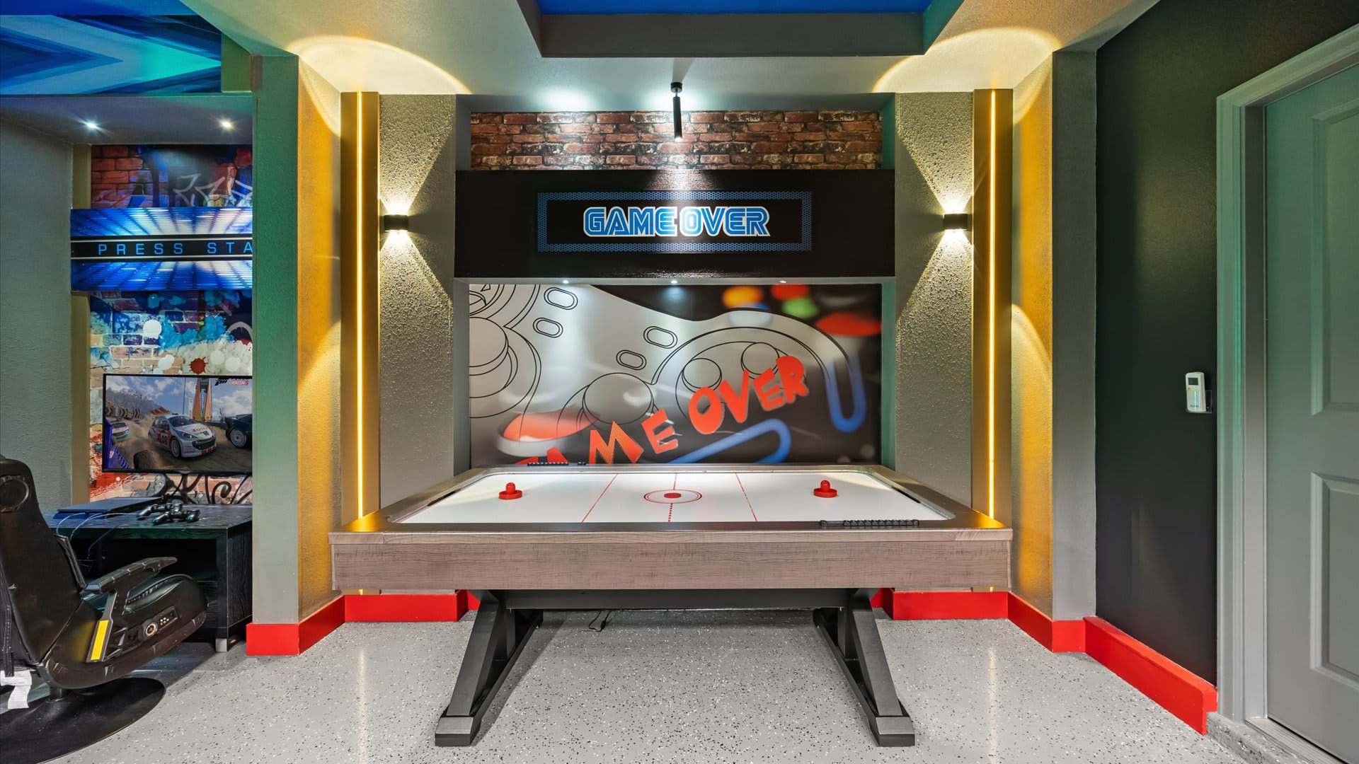 Games room with arcade games and billiards table