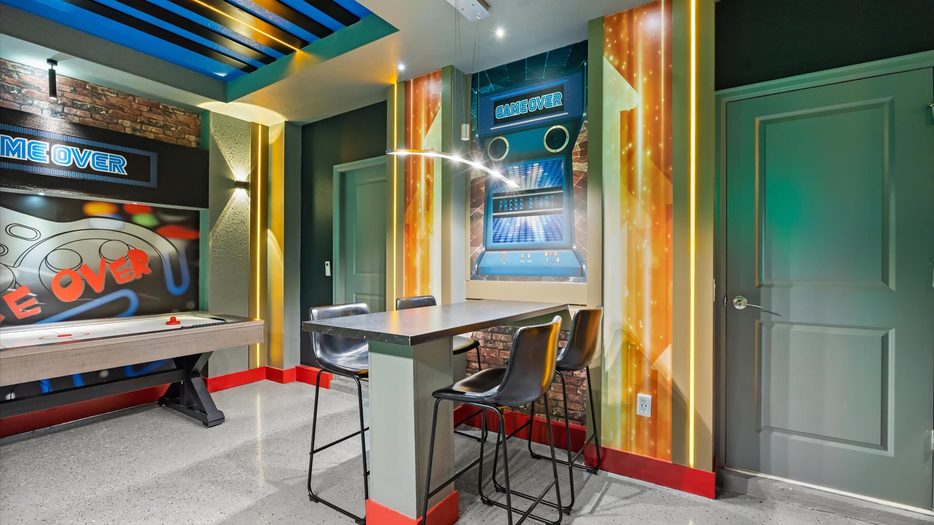 Games room with arcade games and billiards table