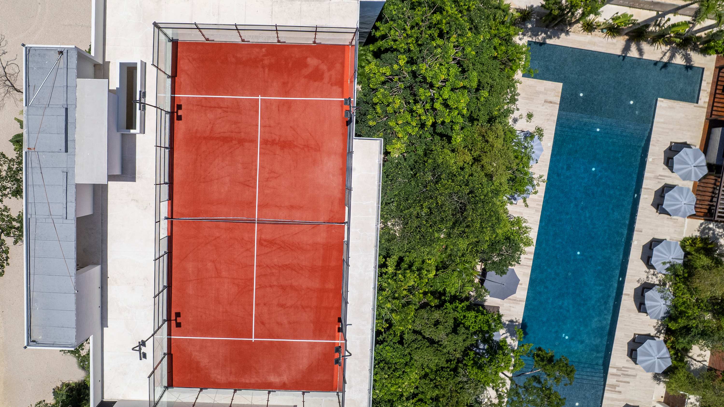 Aerial view showcasing the stunning pool #3 and Paddle court at Karanda