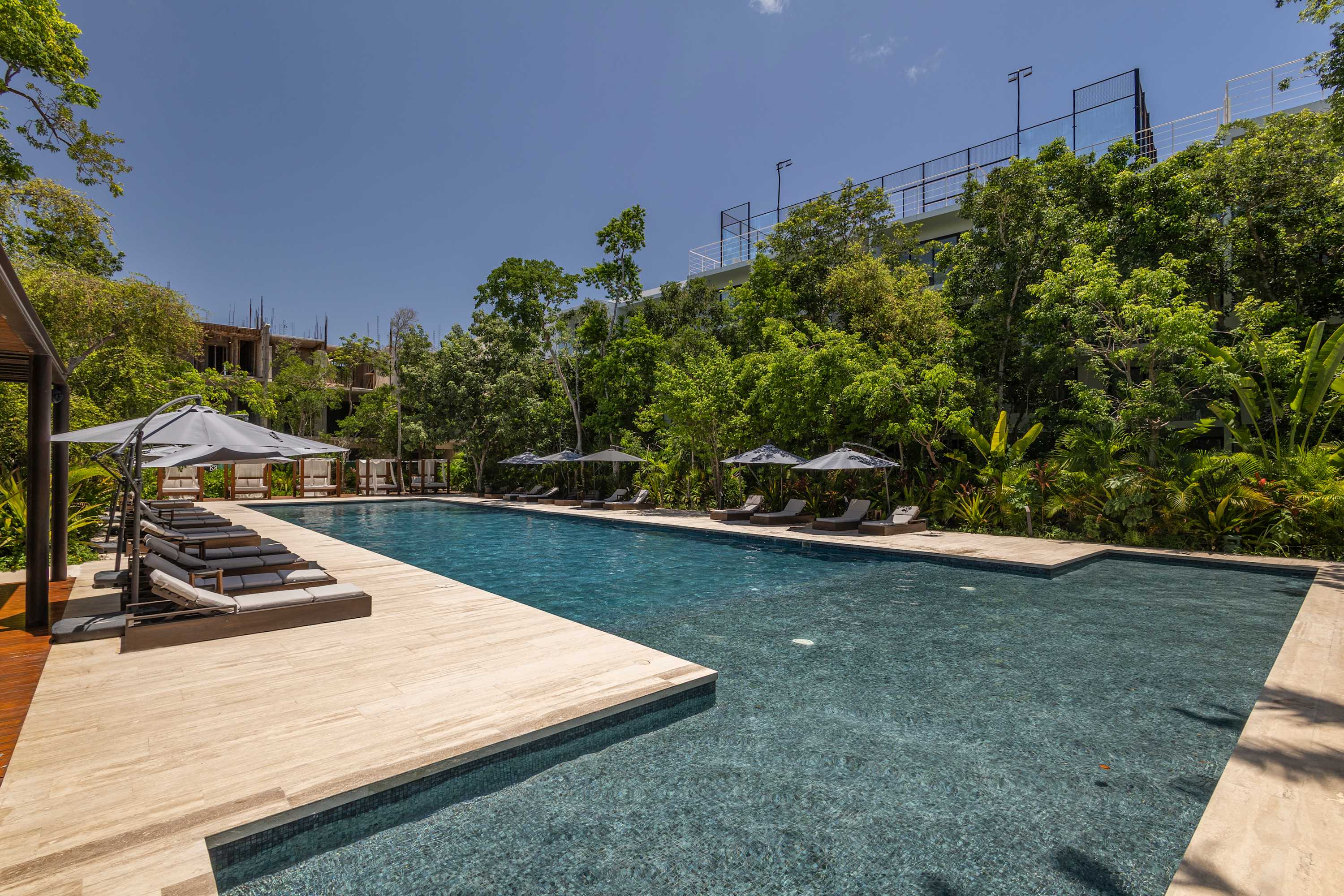 Shared Pool #3 with a cozy lounge area and relaxing sunbeds