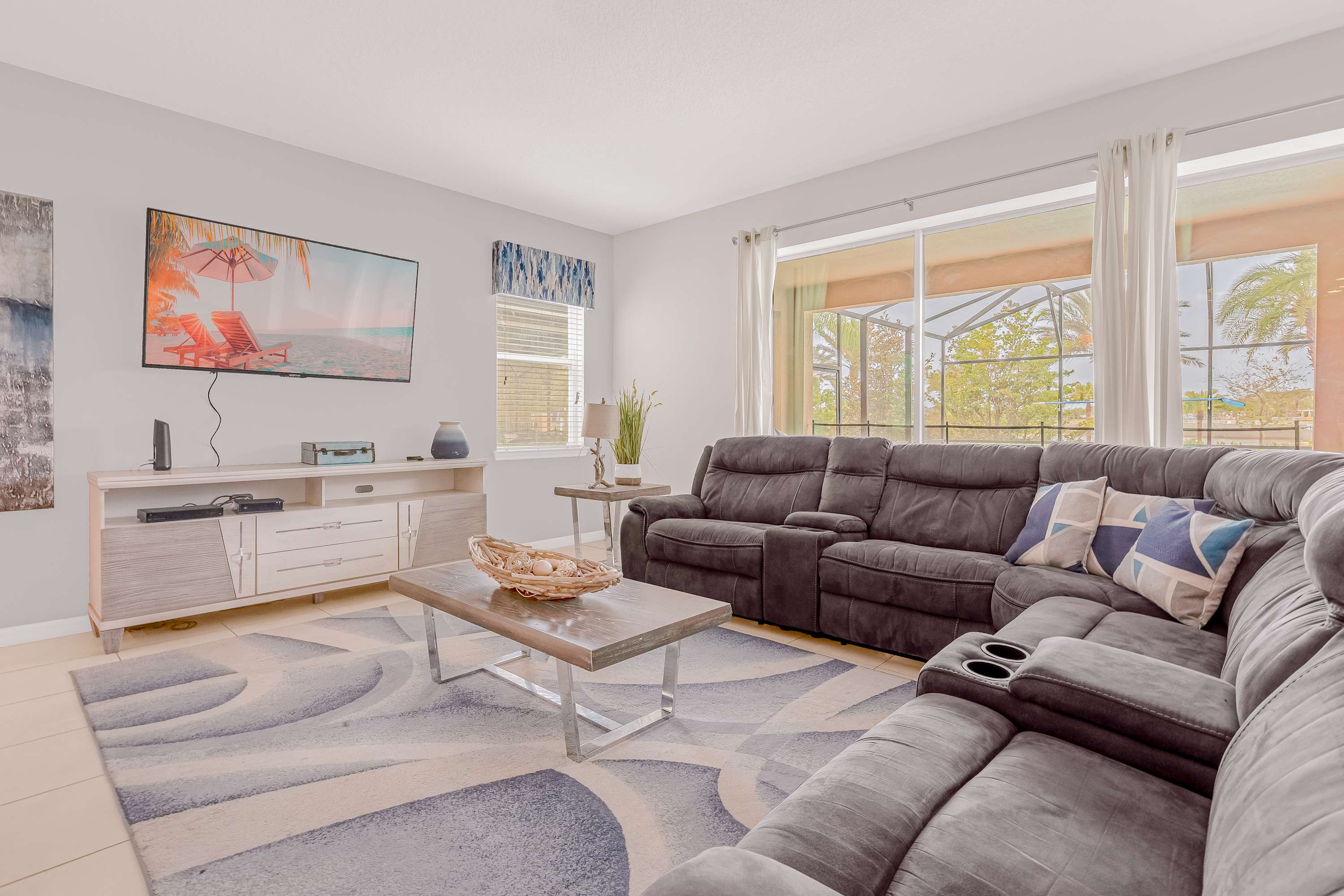 Relax in style in this spacious living room with plush seating and a stunning view. Perfect for unwinding after a day of adventure!