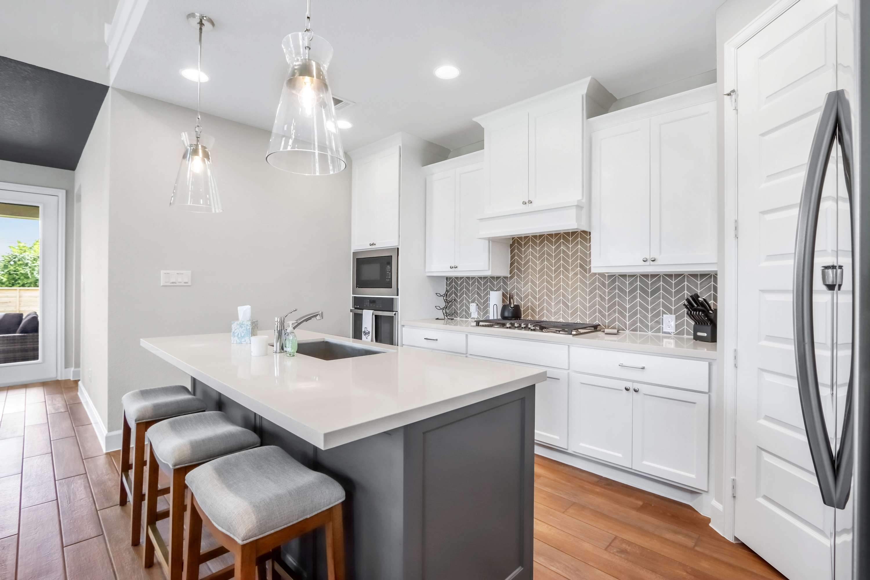 The chic, open kitchen offers ample space & every home comfort