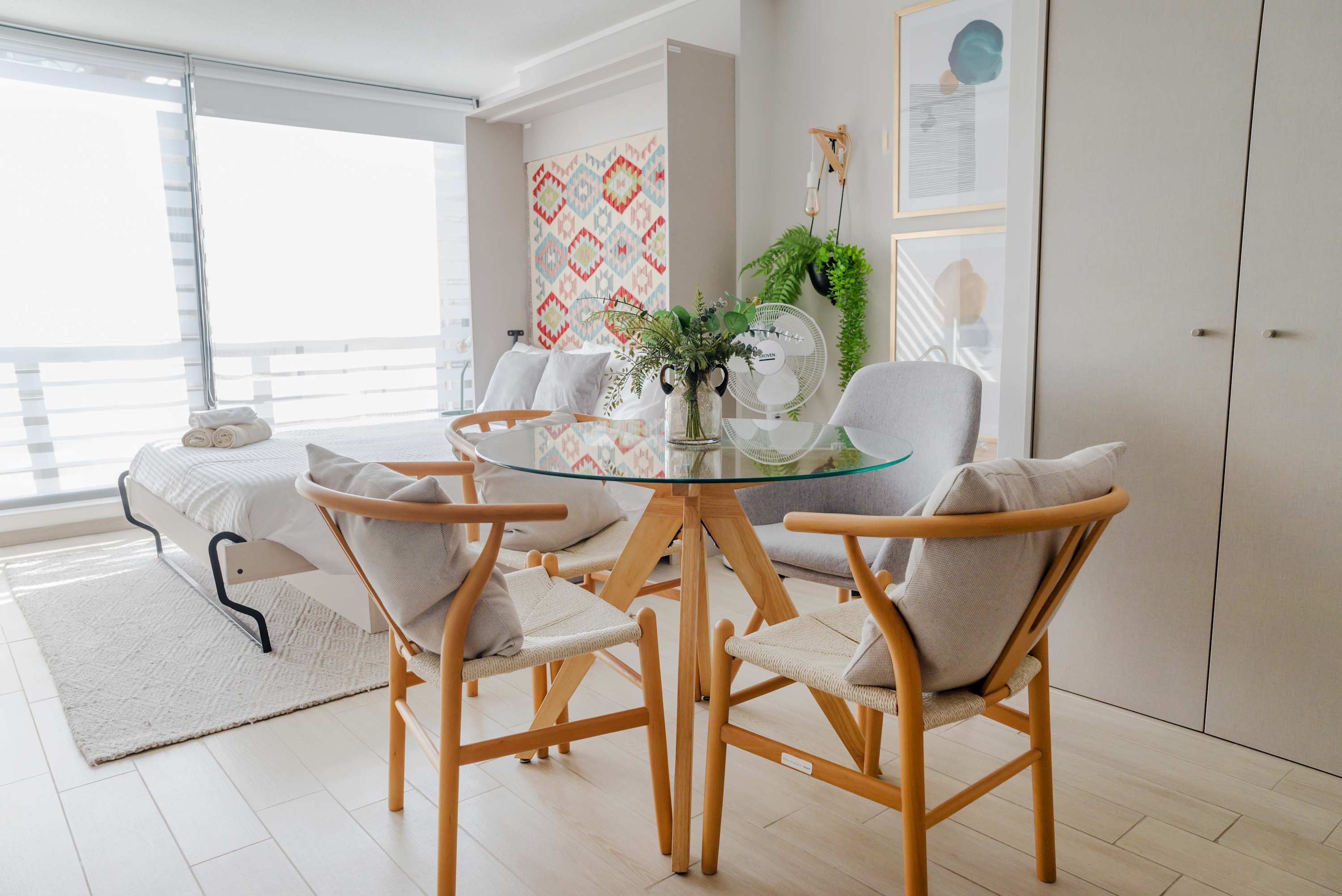 Bright studio with stylish dining area and cozy sleeping space, perfect for a relaxing stay.