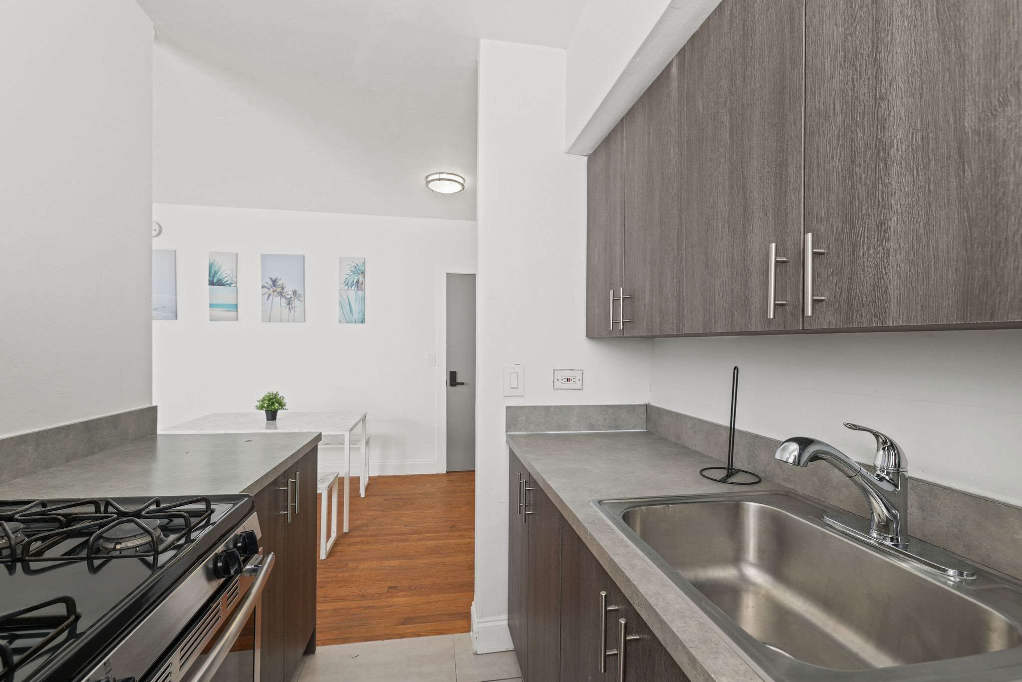 Sleek and modern kitchen with ample counter space, perfect for cooking and dining in style.