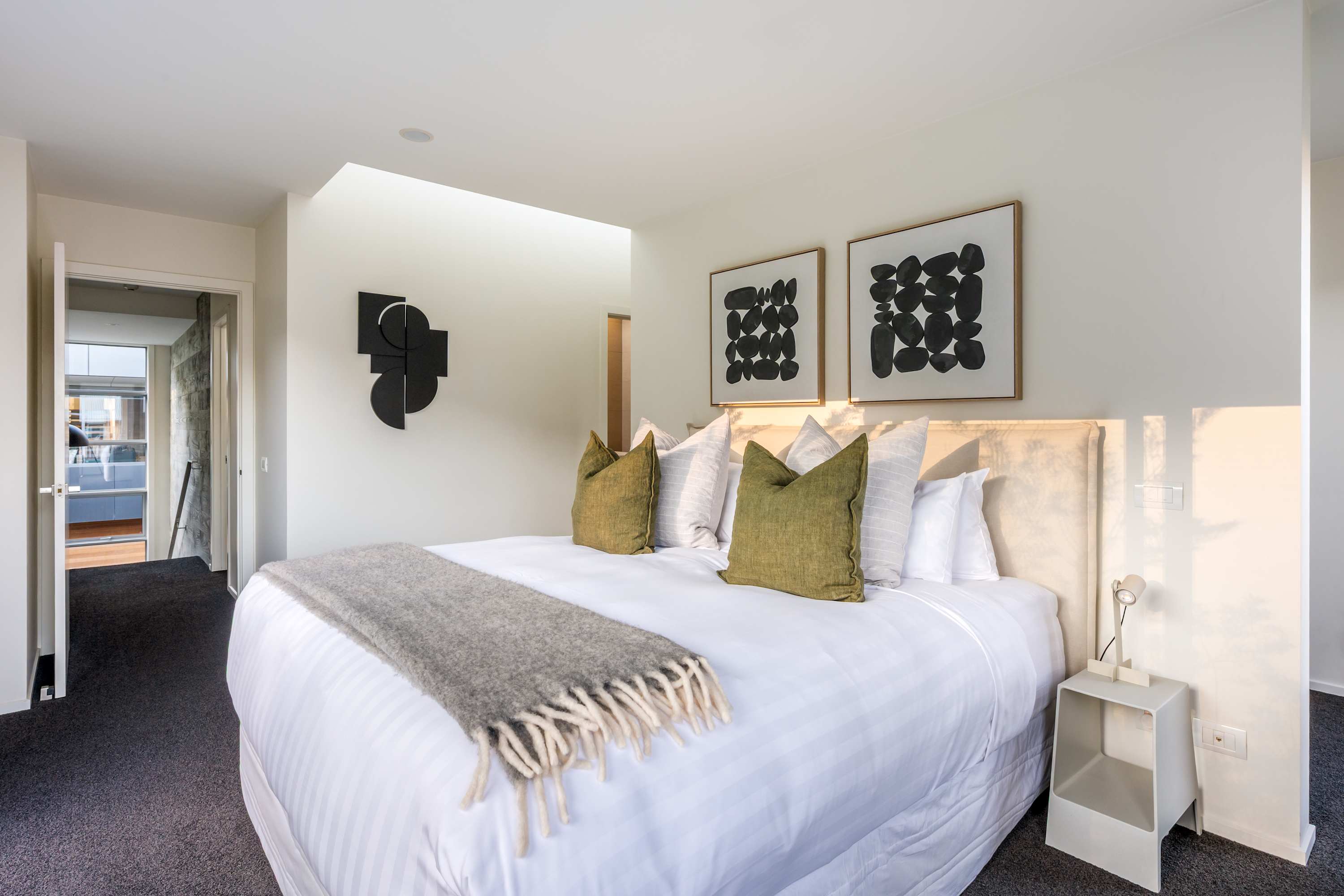 Relax in the Spacious Master Bedroom with Private Patio
Step into this luxurious master bedroom, featuring a comfortable bed and direct access to a private patio. Perfect for unwinding after a day in Queenstown