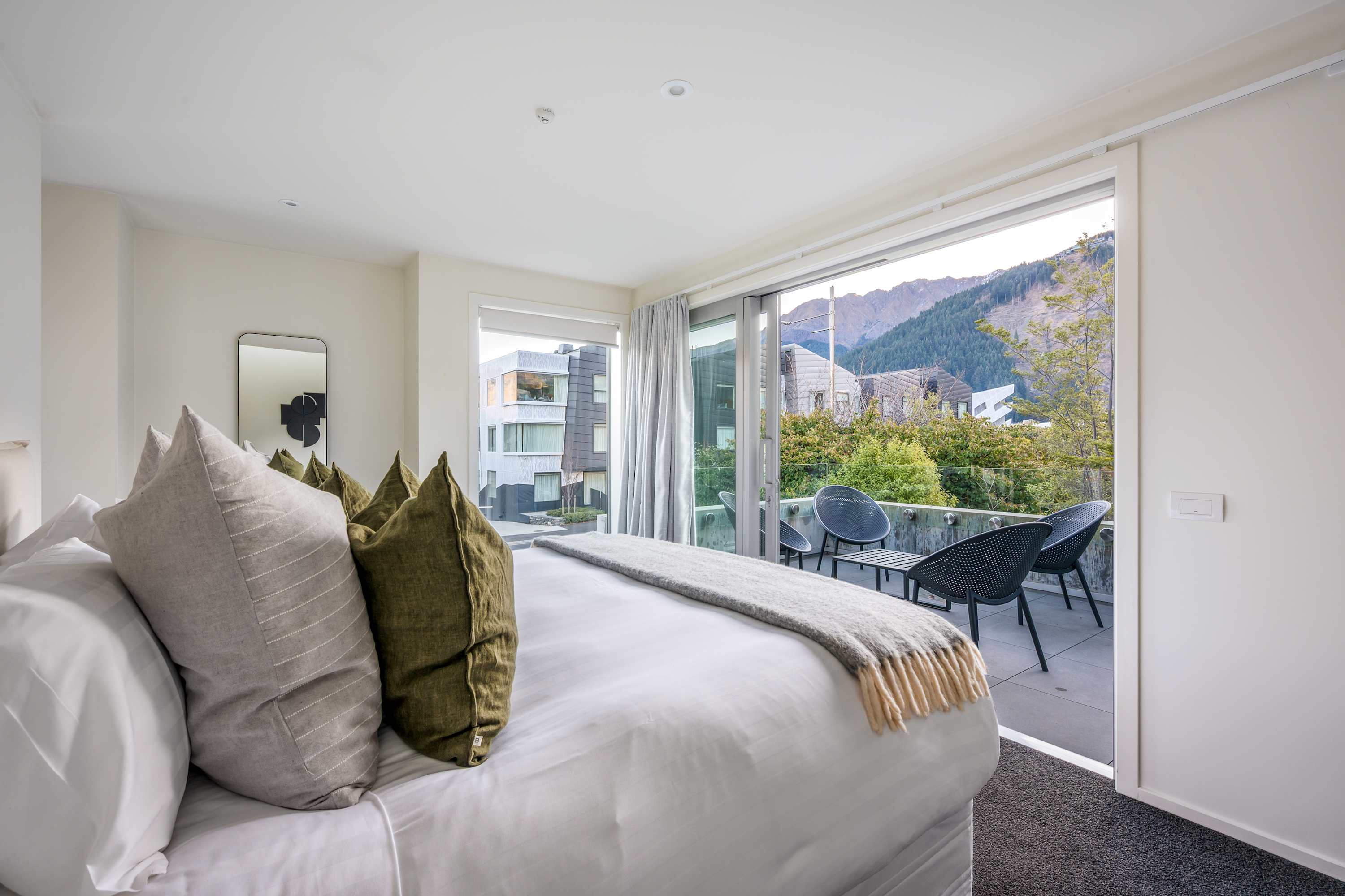 Simply stylish Master Bedroom with Outdoor Access
Step out onto this bright and sunny patio with beautiful morning sun for a fresh start to your Queenstown stay.