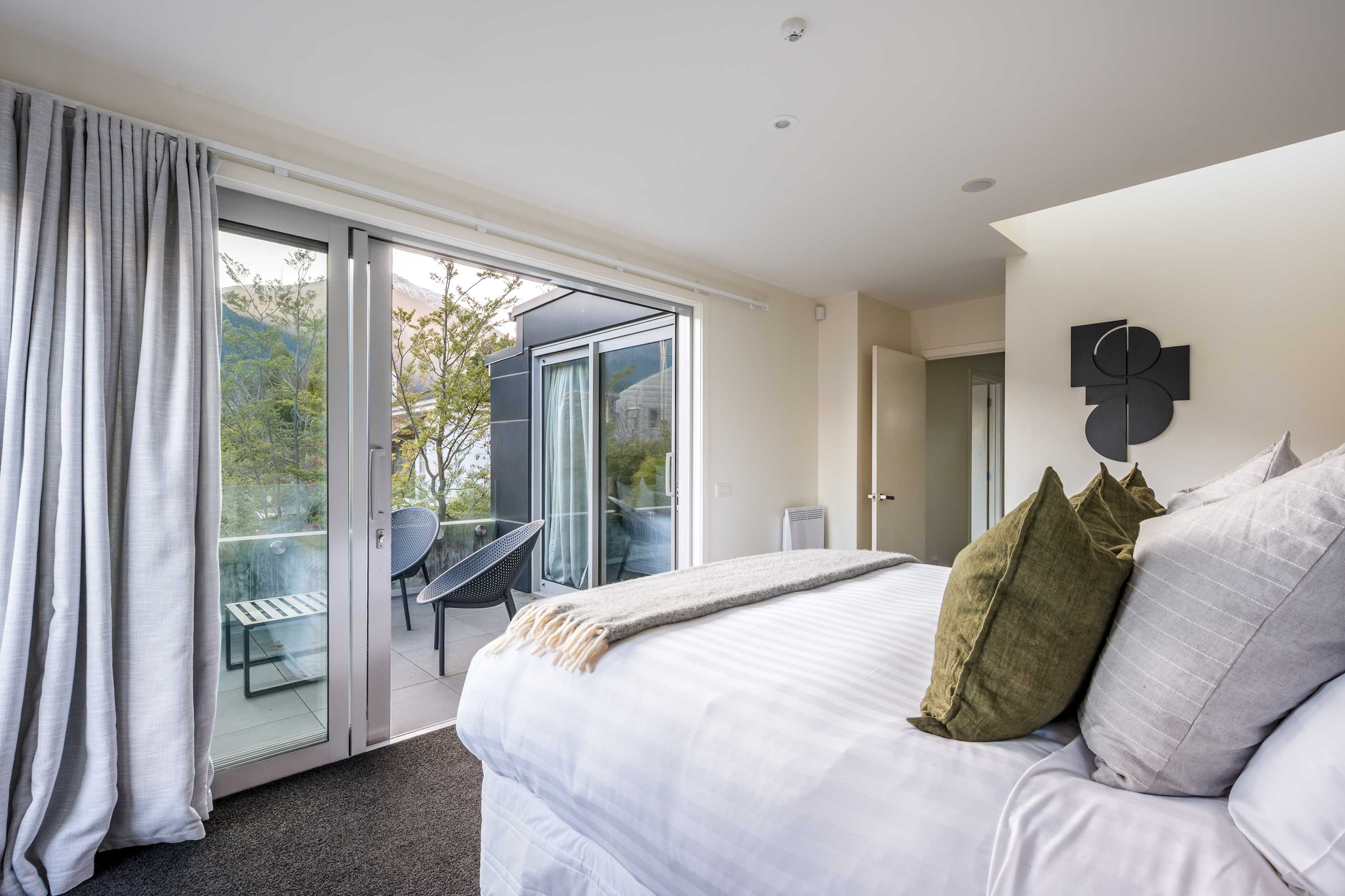Master bedroom with private patio and views