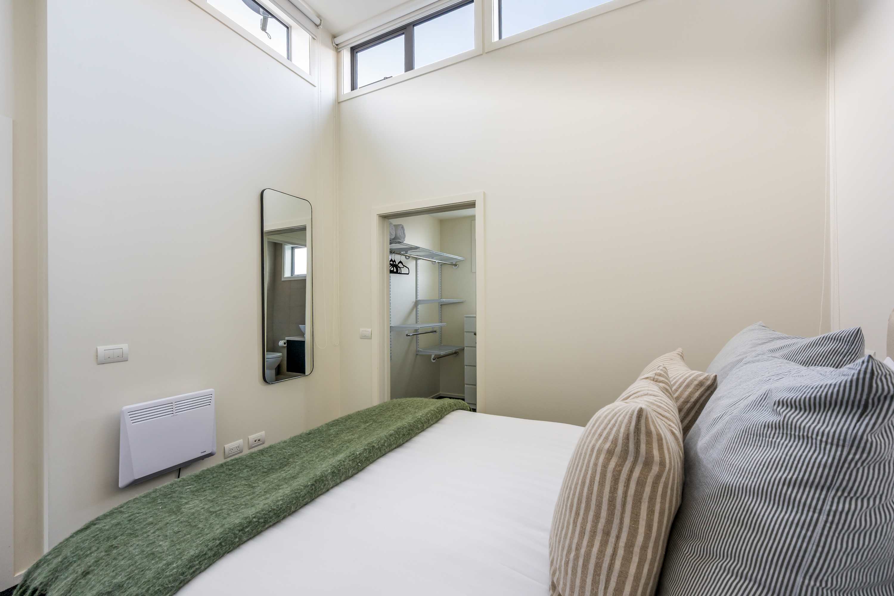 Bright and Comfortable Second Bedroom
The second bedroom features a cozy bed, stylish décor, and plenty of natural light. A perfect space for relaxing, whether you’re here for a short stay or an extended getaway in Queenstown.