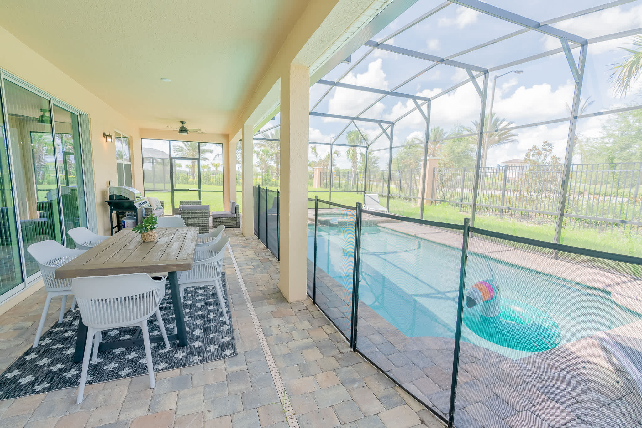 Relax on the spacious patio with a private pool, perfect for family gatherings and outdoor dining.