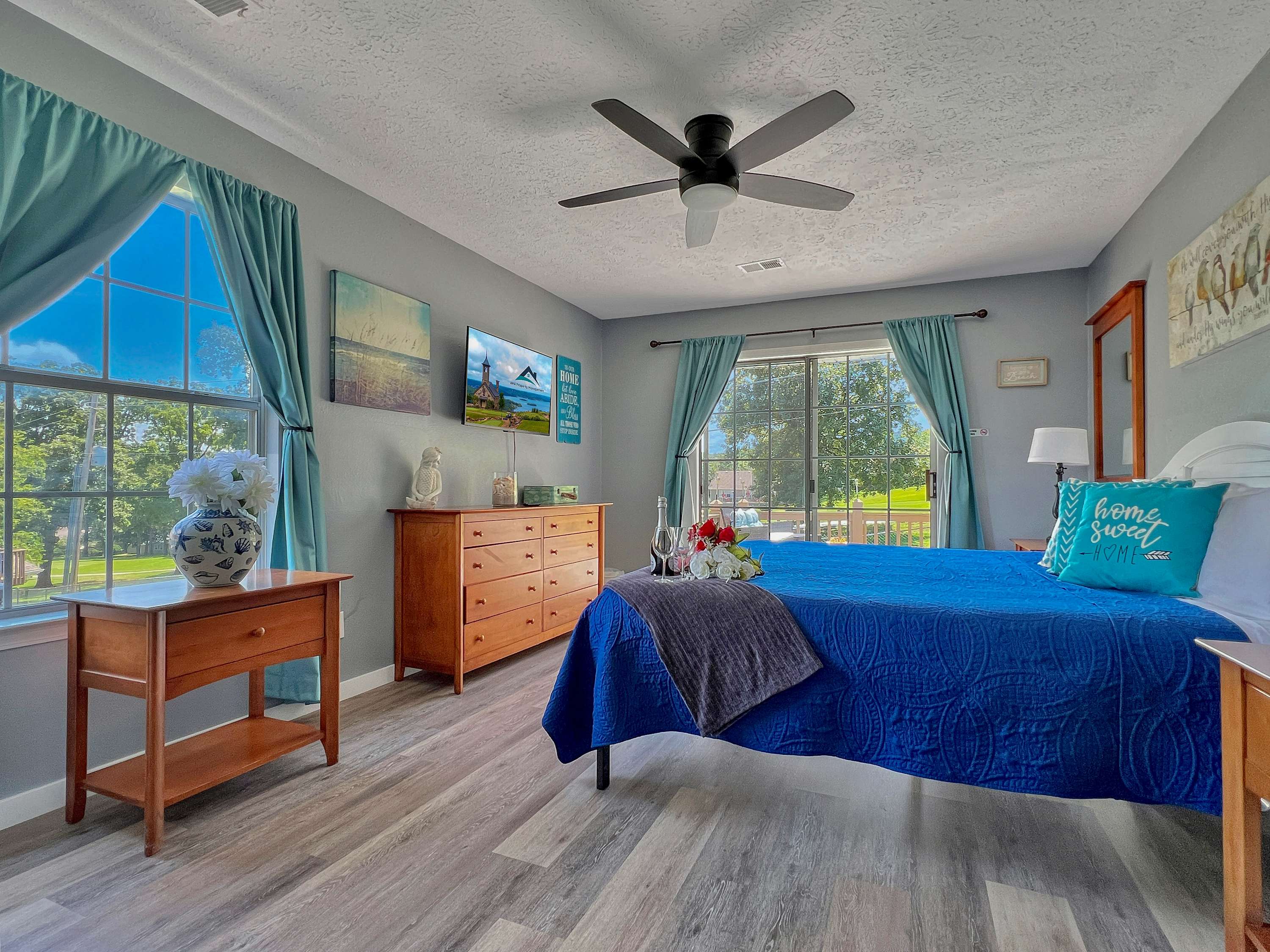 Beautiful master bedroom with king size bed and sliding doors on the patio
