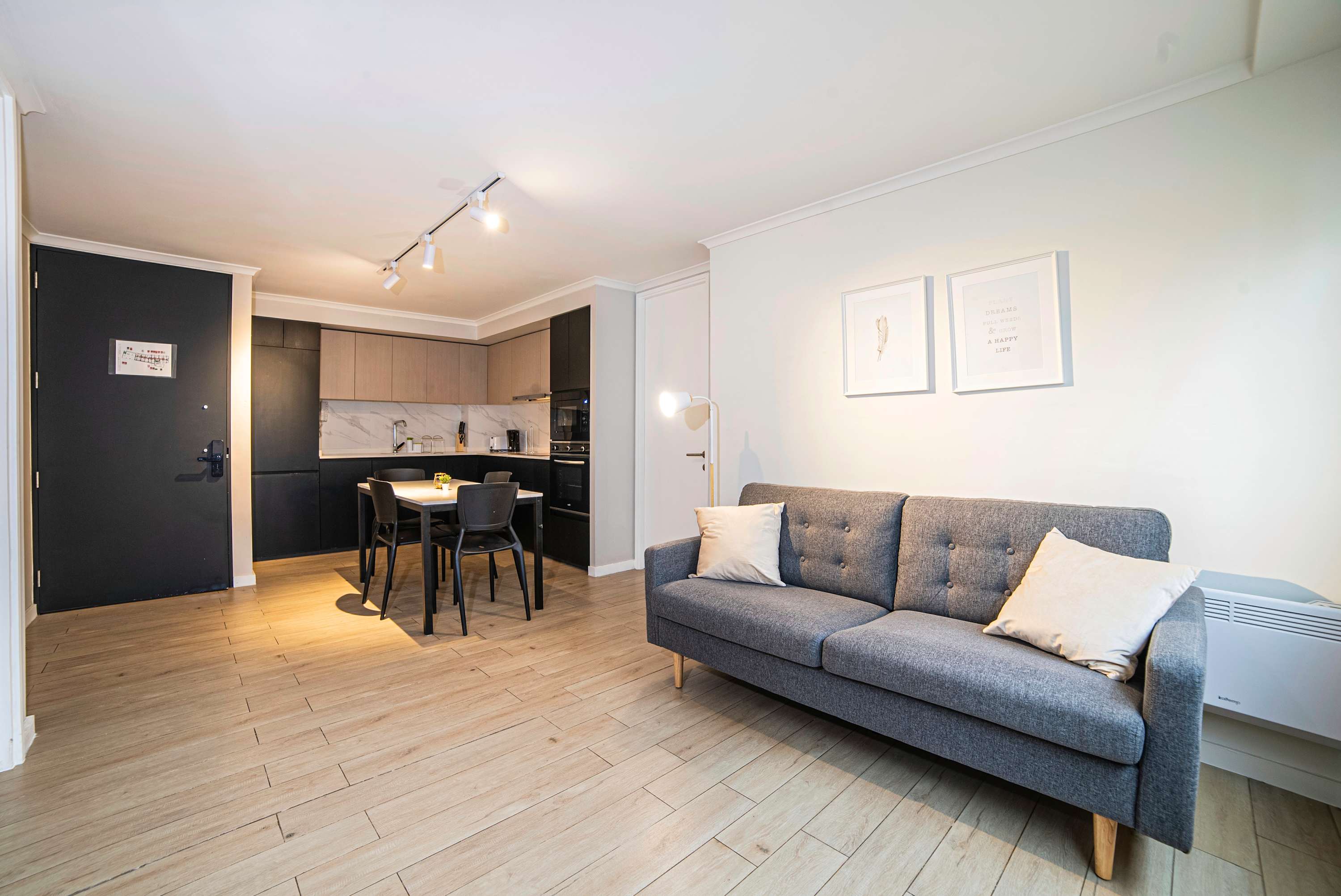 Cozy and modern living space with a sleek kitchen and comfortable seating, perfect for relaxing after a day of exploring.