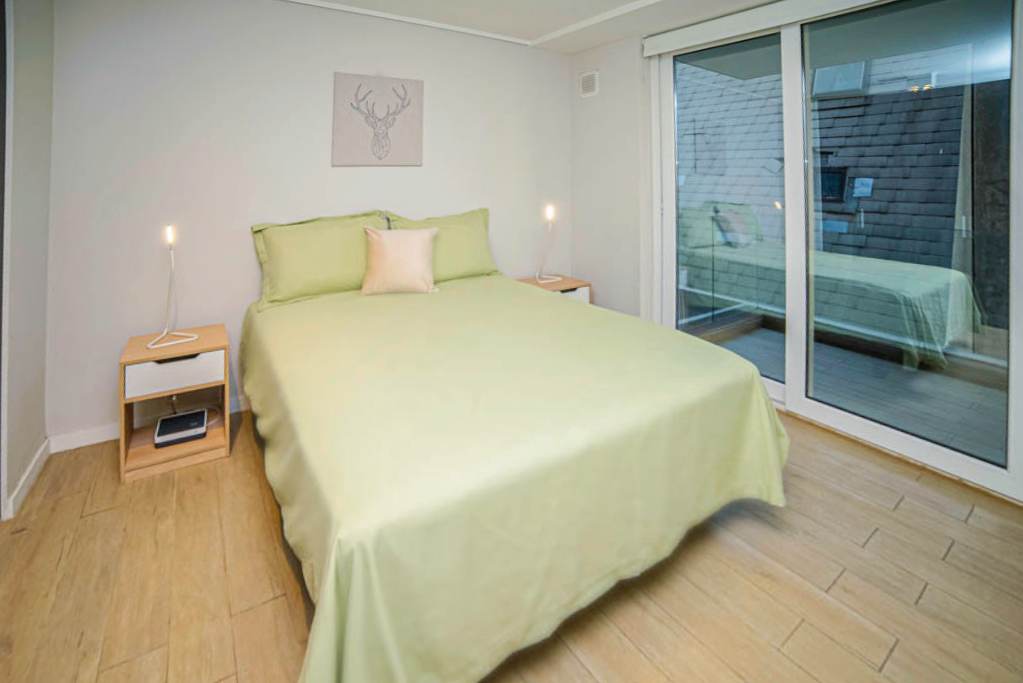 Cozy bedroom with direct access to a private outdoor space, perfect for relaxation.