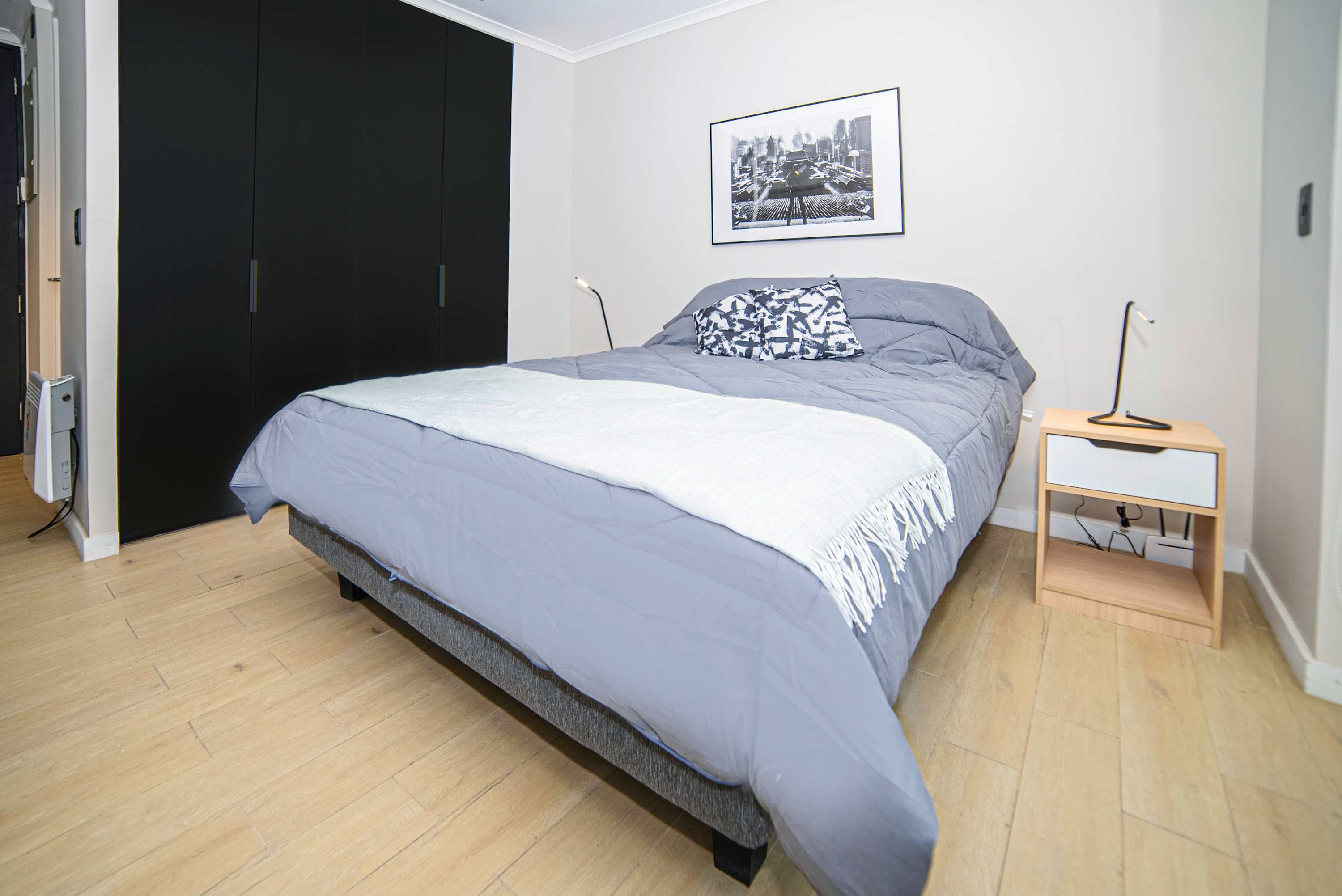 Relax in this stylish studio with a comfy bed and sleek decor, perfect for a cozy stay in the heart of the city.