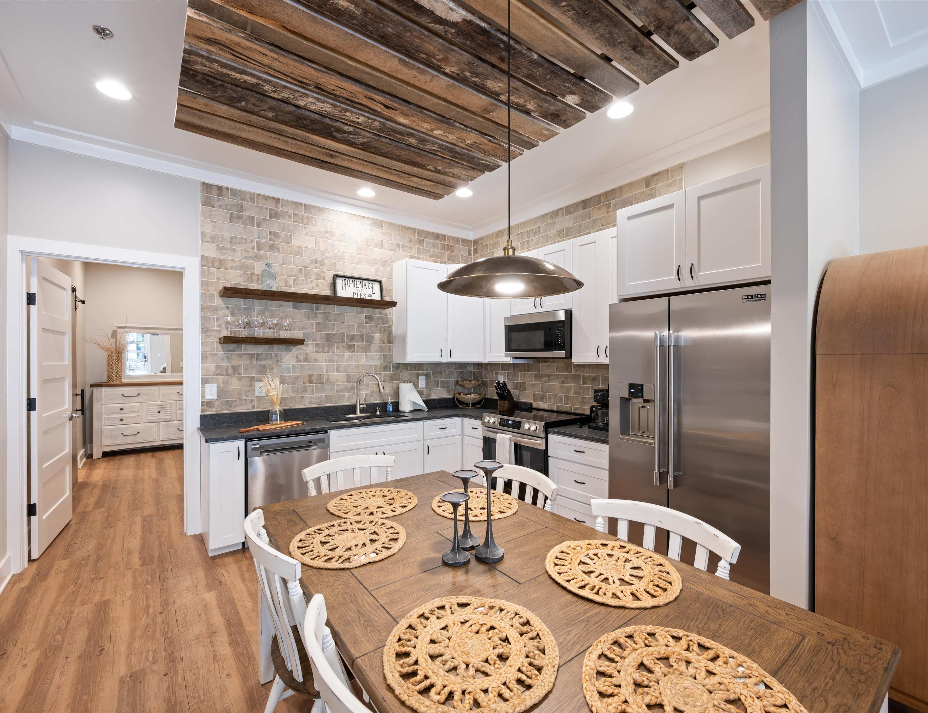 The charming eat-in kitchen offers ample space & every home comfort​