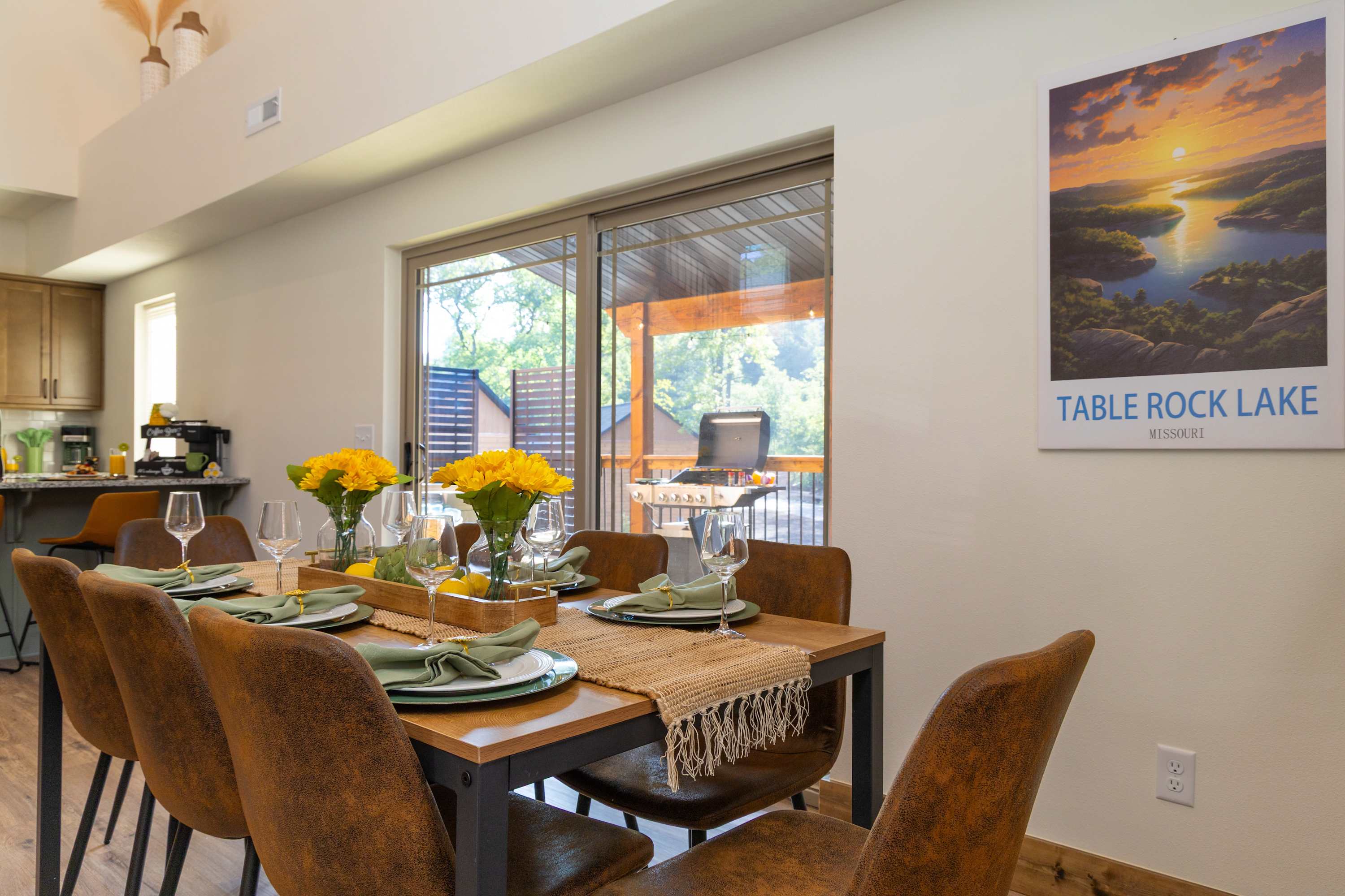 Framed by the ambient glow of the nearby fireplace and illuminated by natural light streaming through expansive windows, this space invites everything from leisurely brunches to festive family feasts.