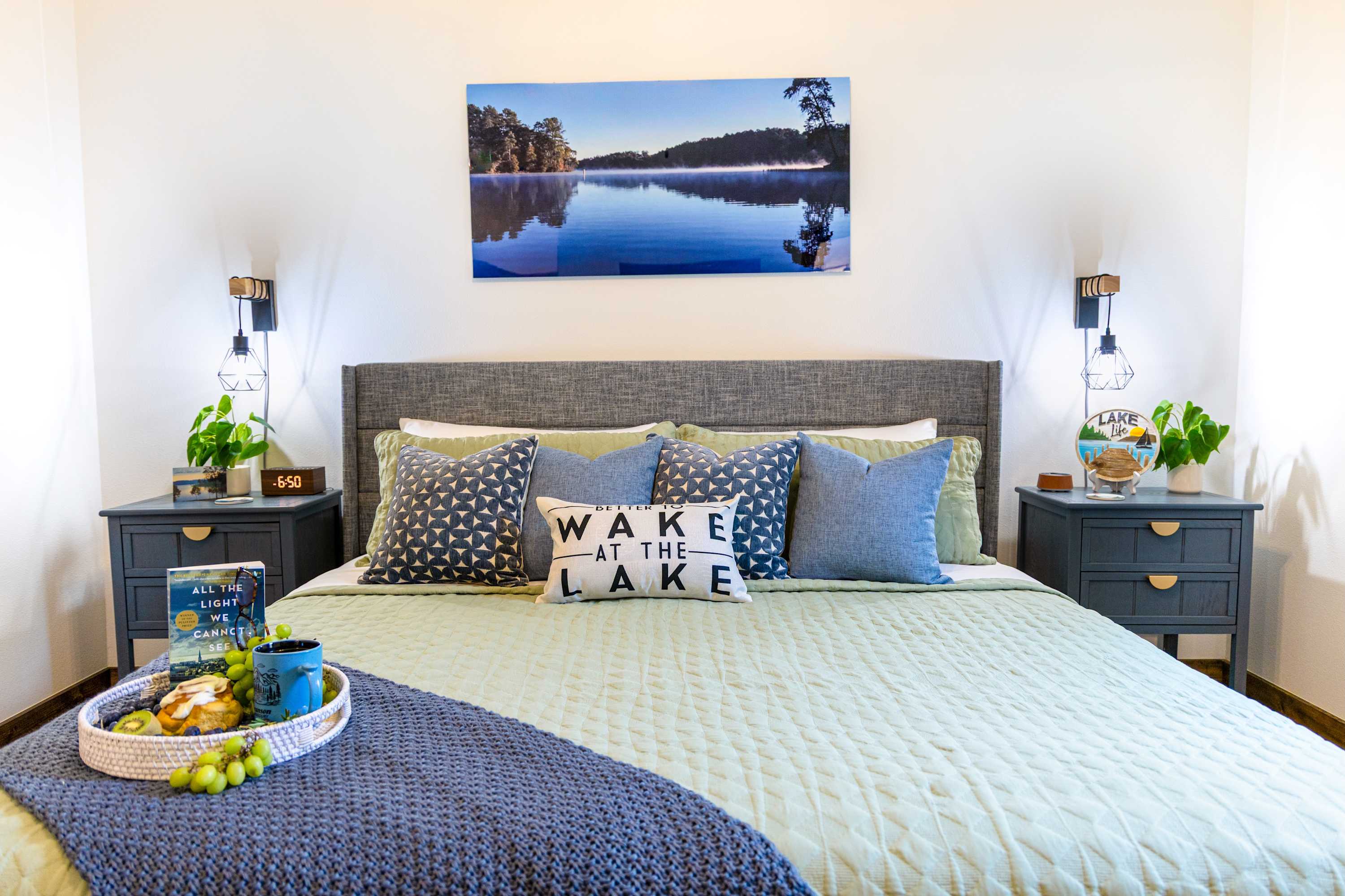 Step into a sanctuary of serenity in this upstairs primary suite, designed to echo the soothing rhythm of nearby Table Rock Lake.