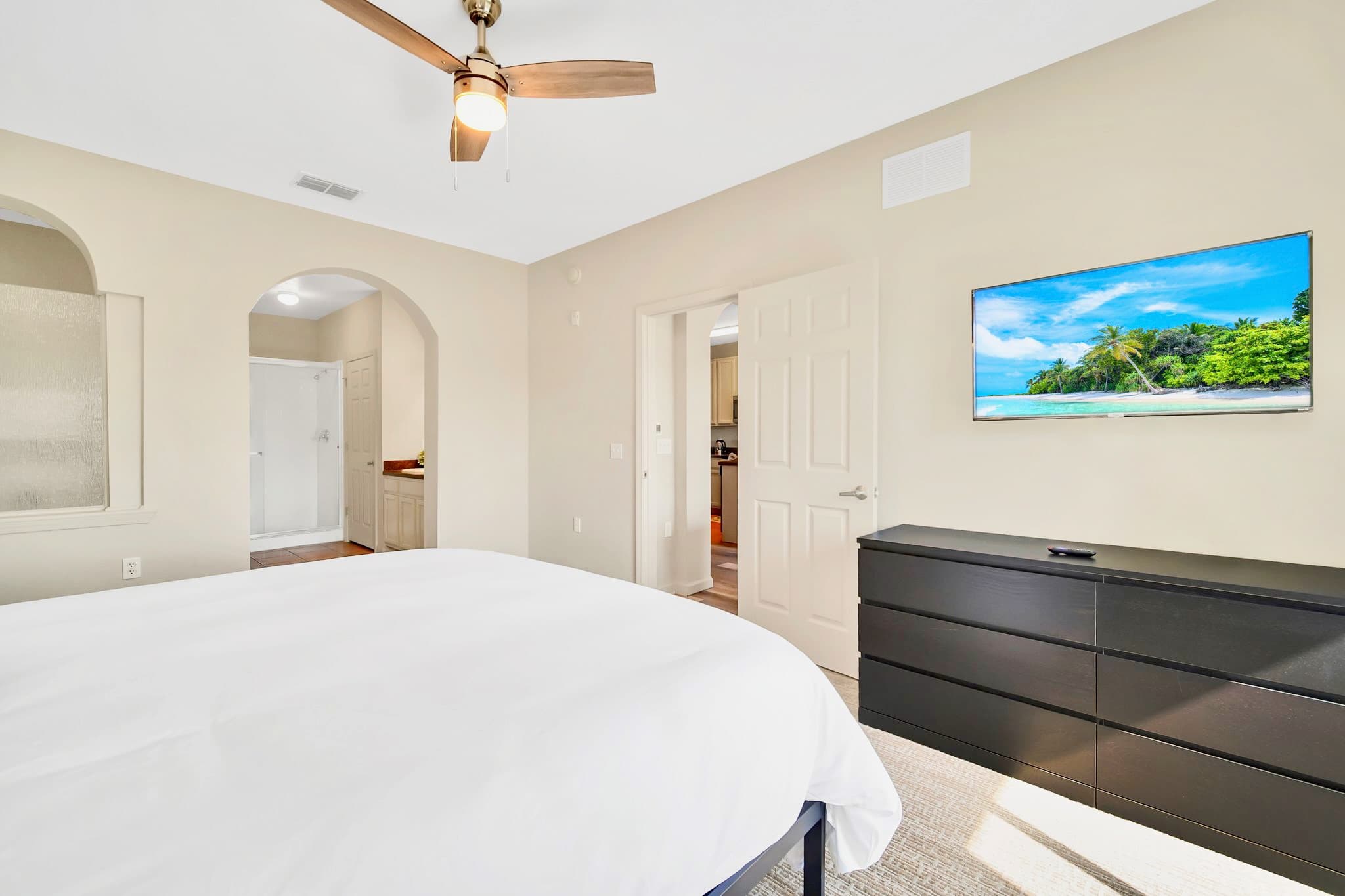 King bedroom with smart TV and en-suite bathroom