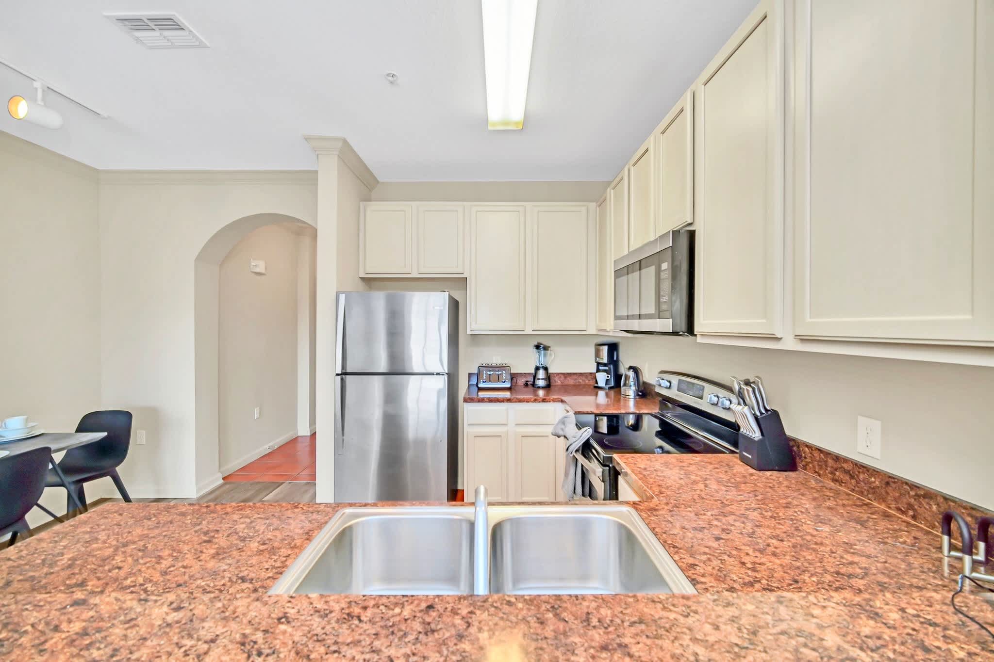 Fully equipped kitchen with silver appliances