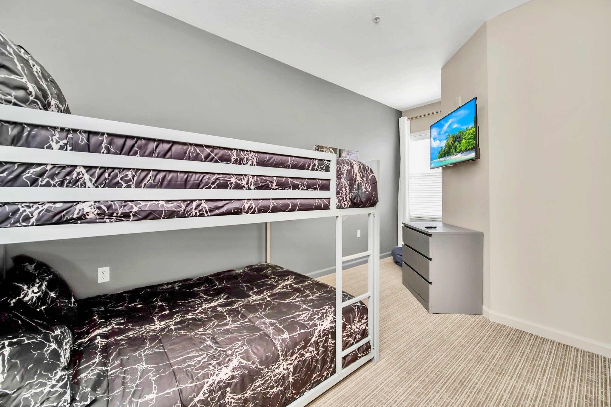 Bunk bedroom with smart TV