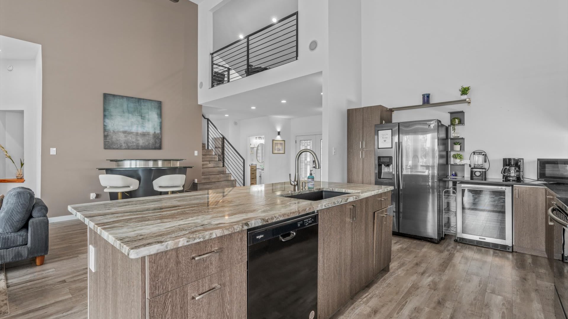 Modern fully equipped kitchen with silver appliances