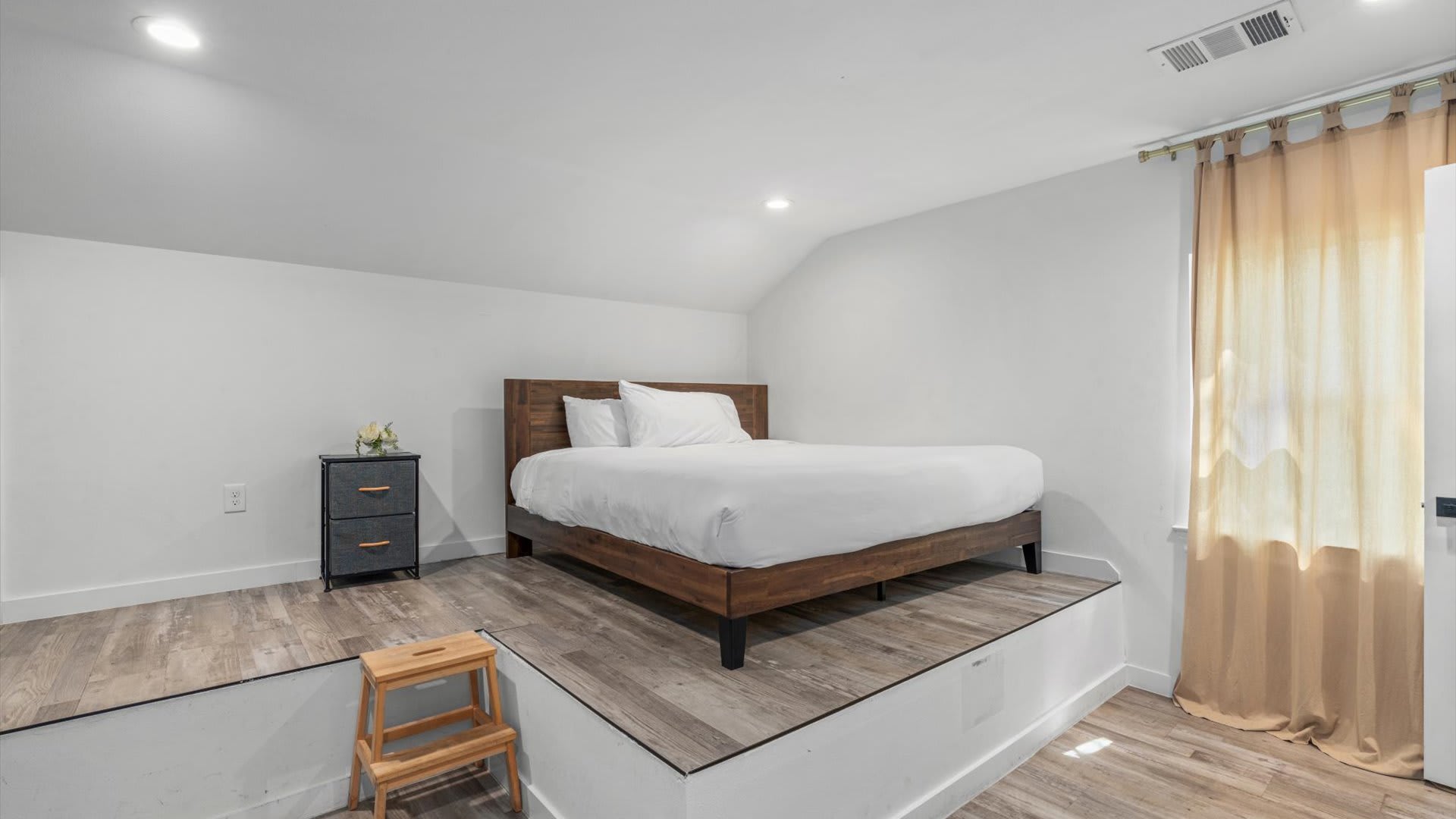 High rise king bedroom with fresh linens