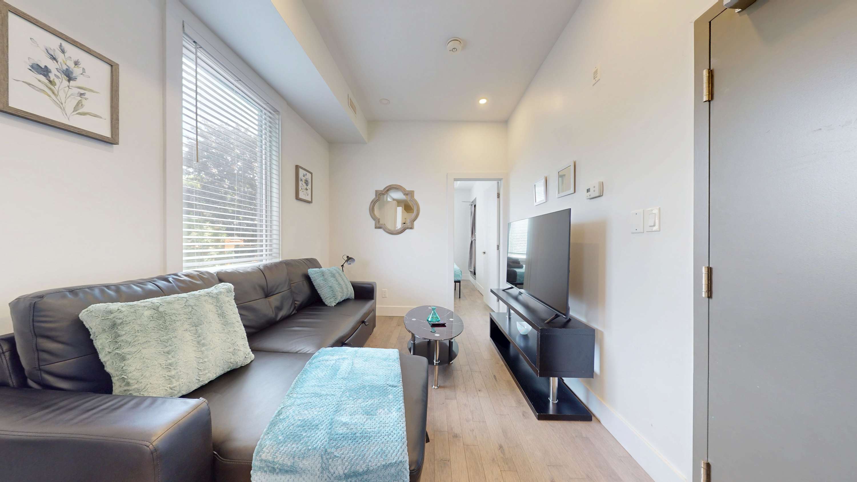 Living room with sofa bed and smart TV