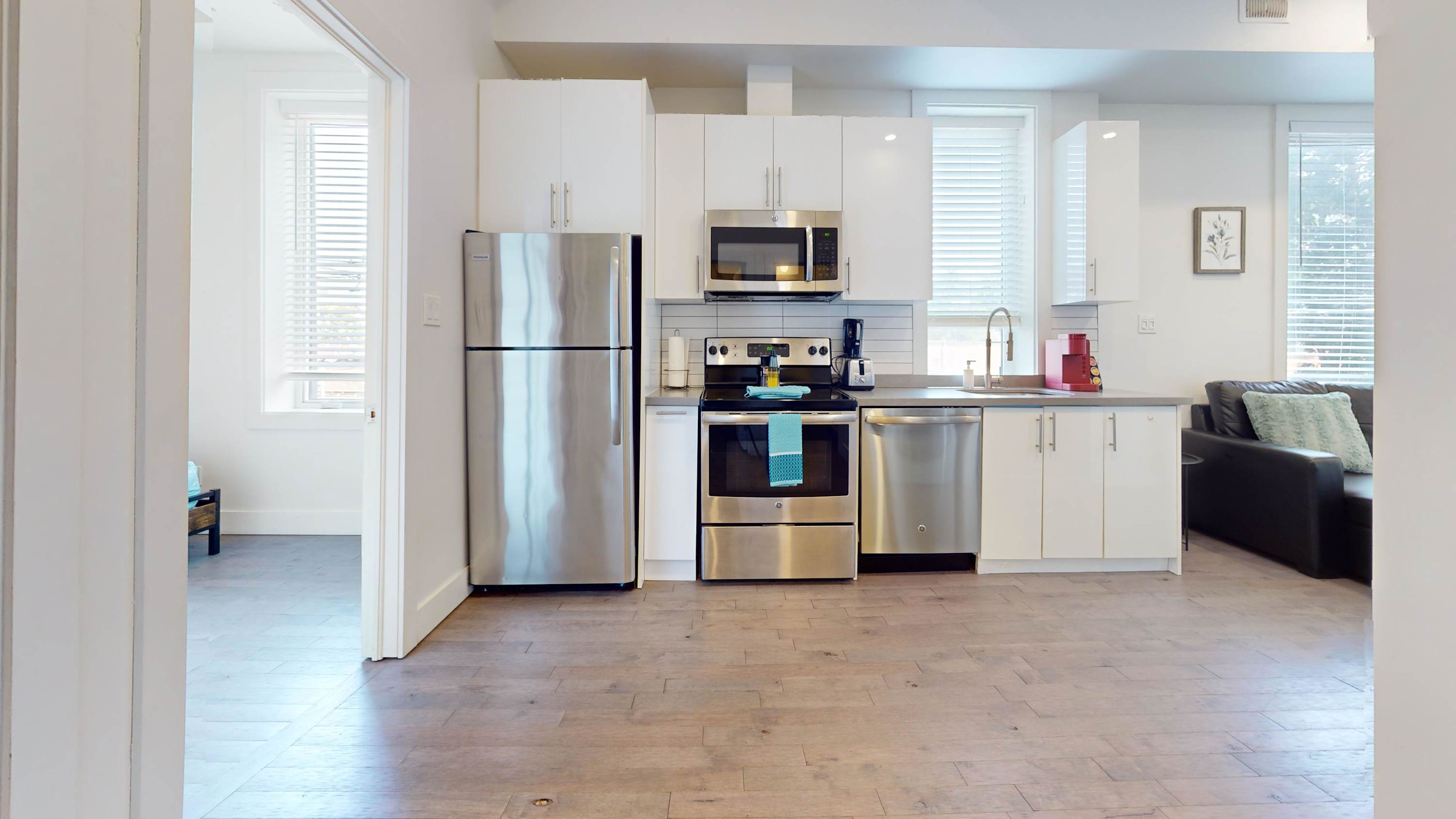 Open-layout kitchen with silver appliances