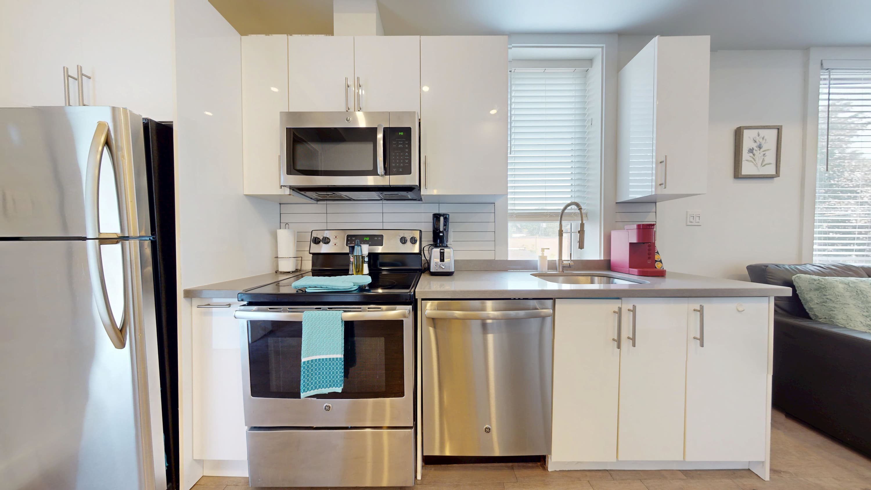 Open-layout kitchen with silver appliances