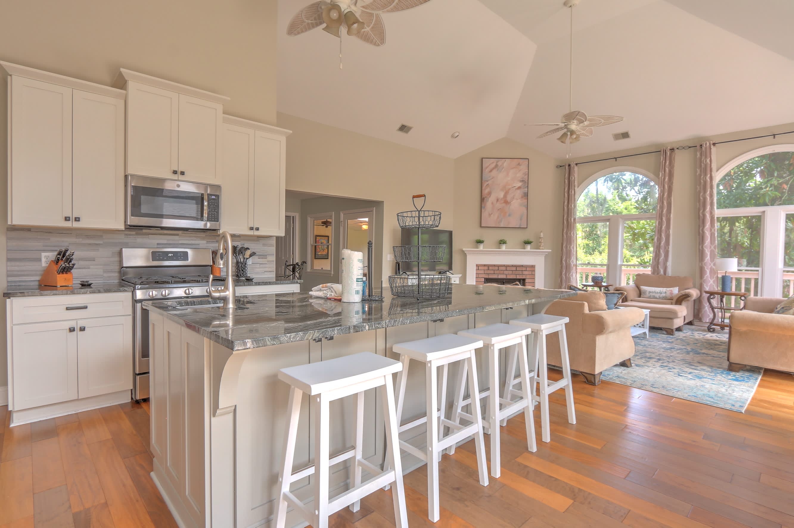 Well appointed kitchen with granite counters and stainless appliances