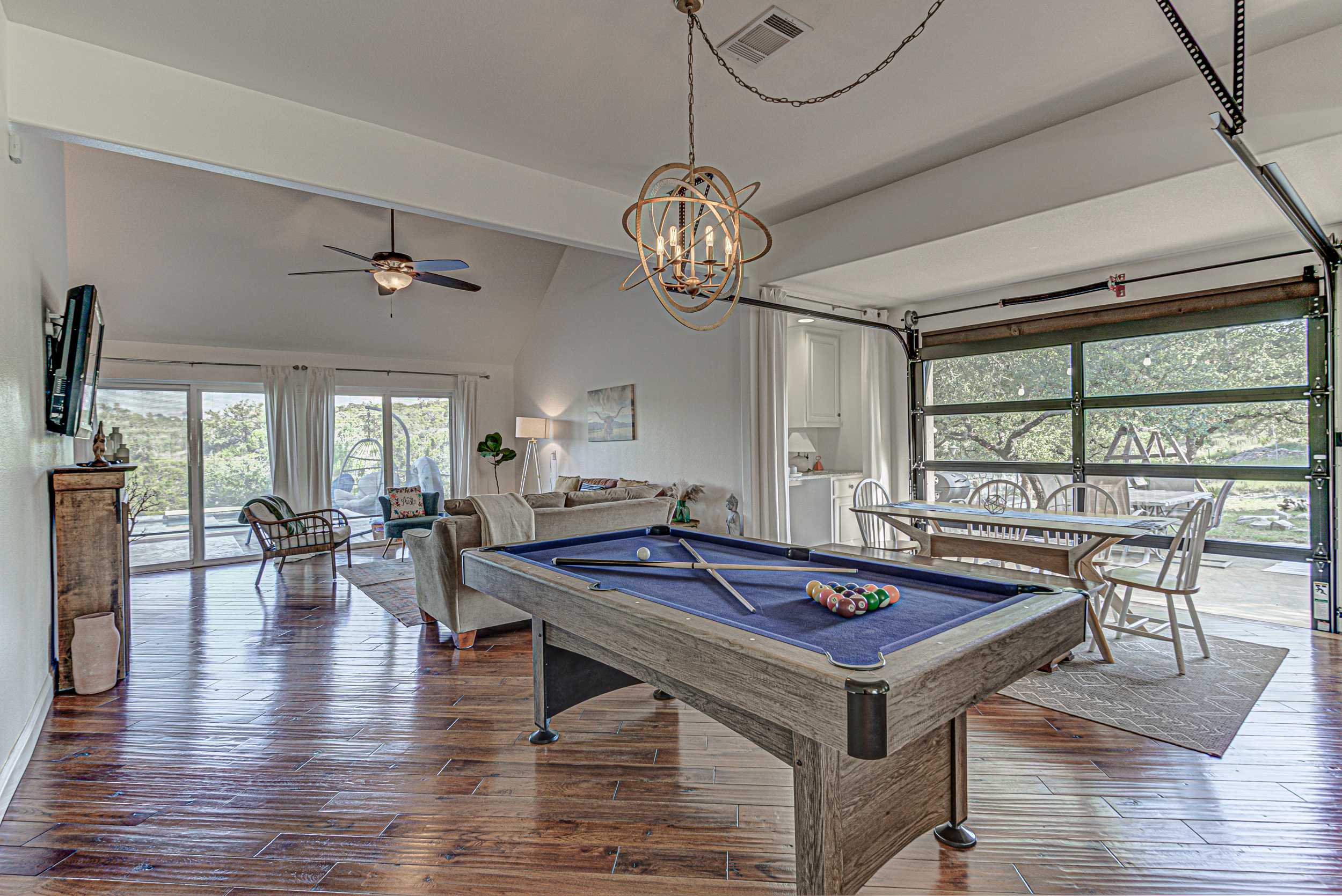 Enjoy a game of pool in this open concept home 