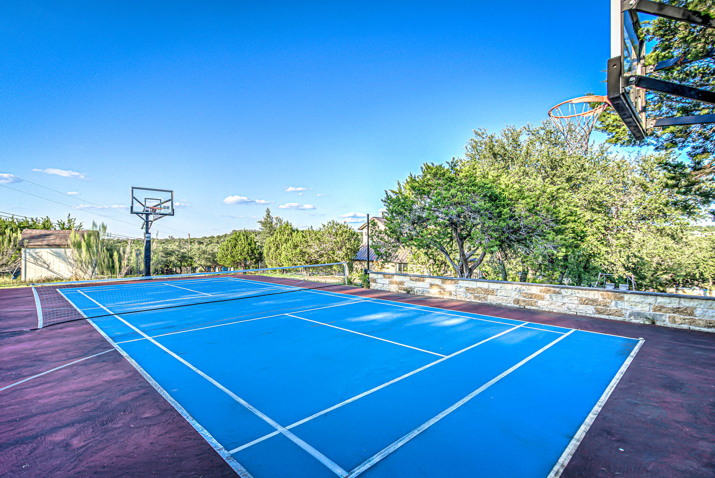 Whether you want to play basketball, Tennis, or pickleball, this home has it all! 