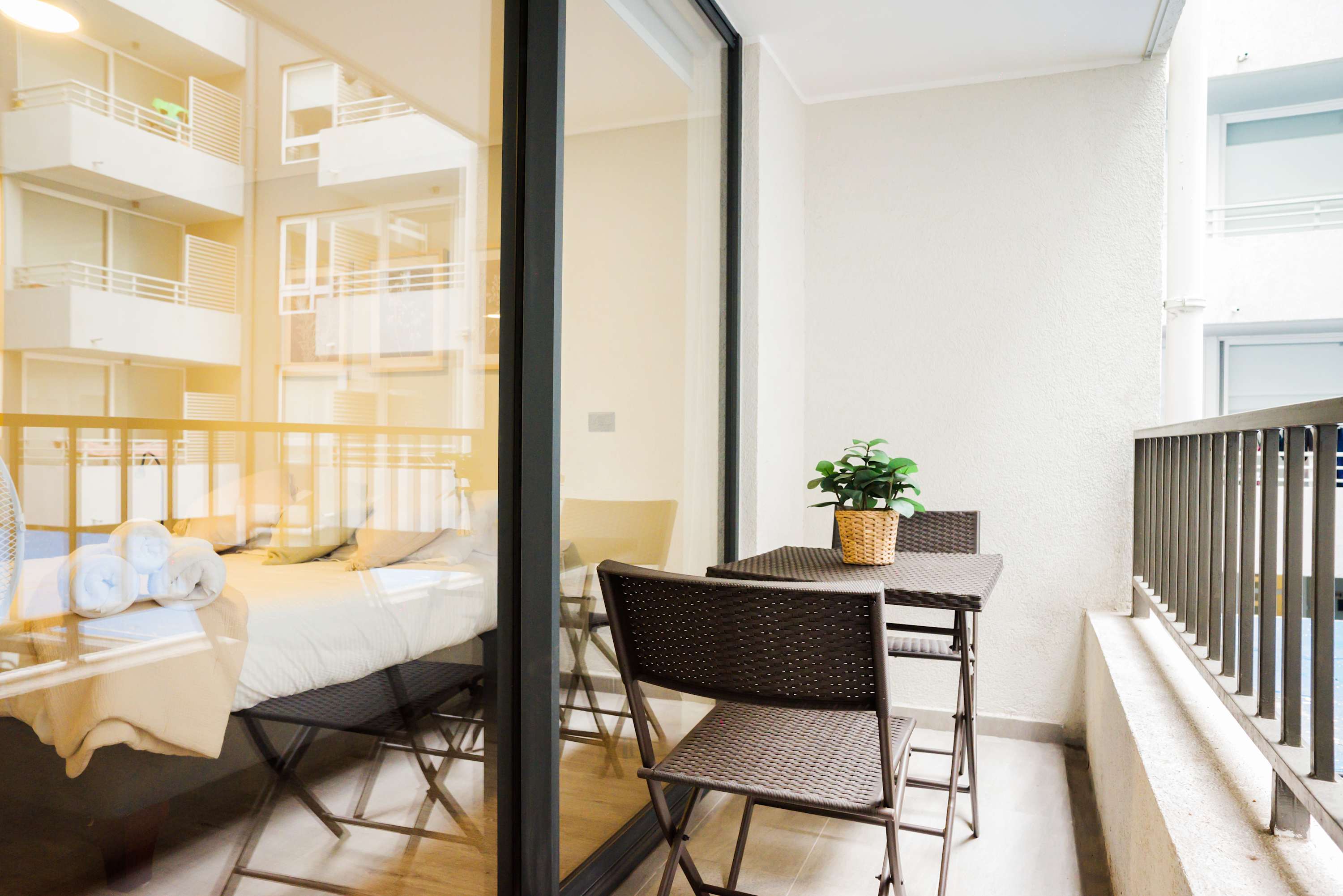 Relax on your private balcony with a morning coffee, enjoying the serene view of the courtyard.