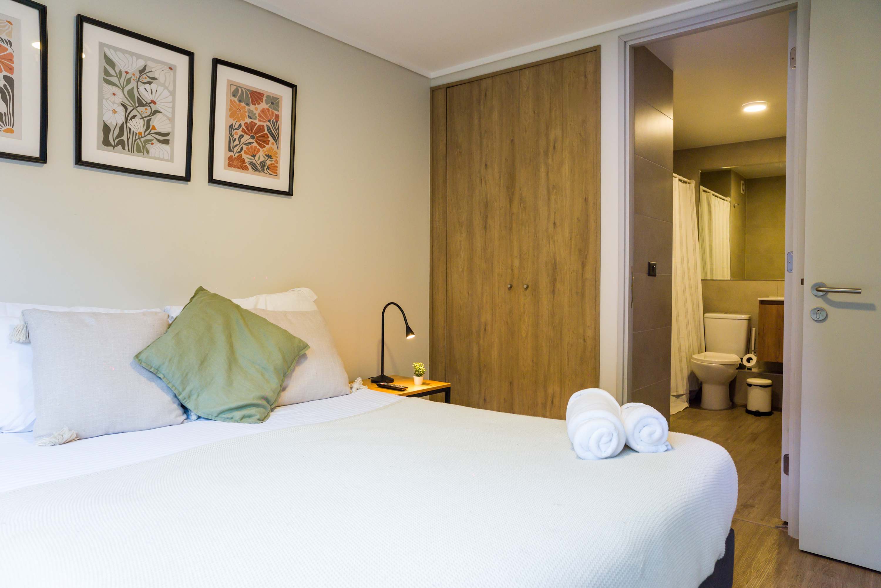Relax in this cozy bedroom with modern decor and convenient ensuite bathroom.