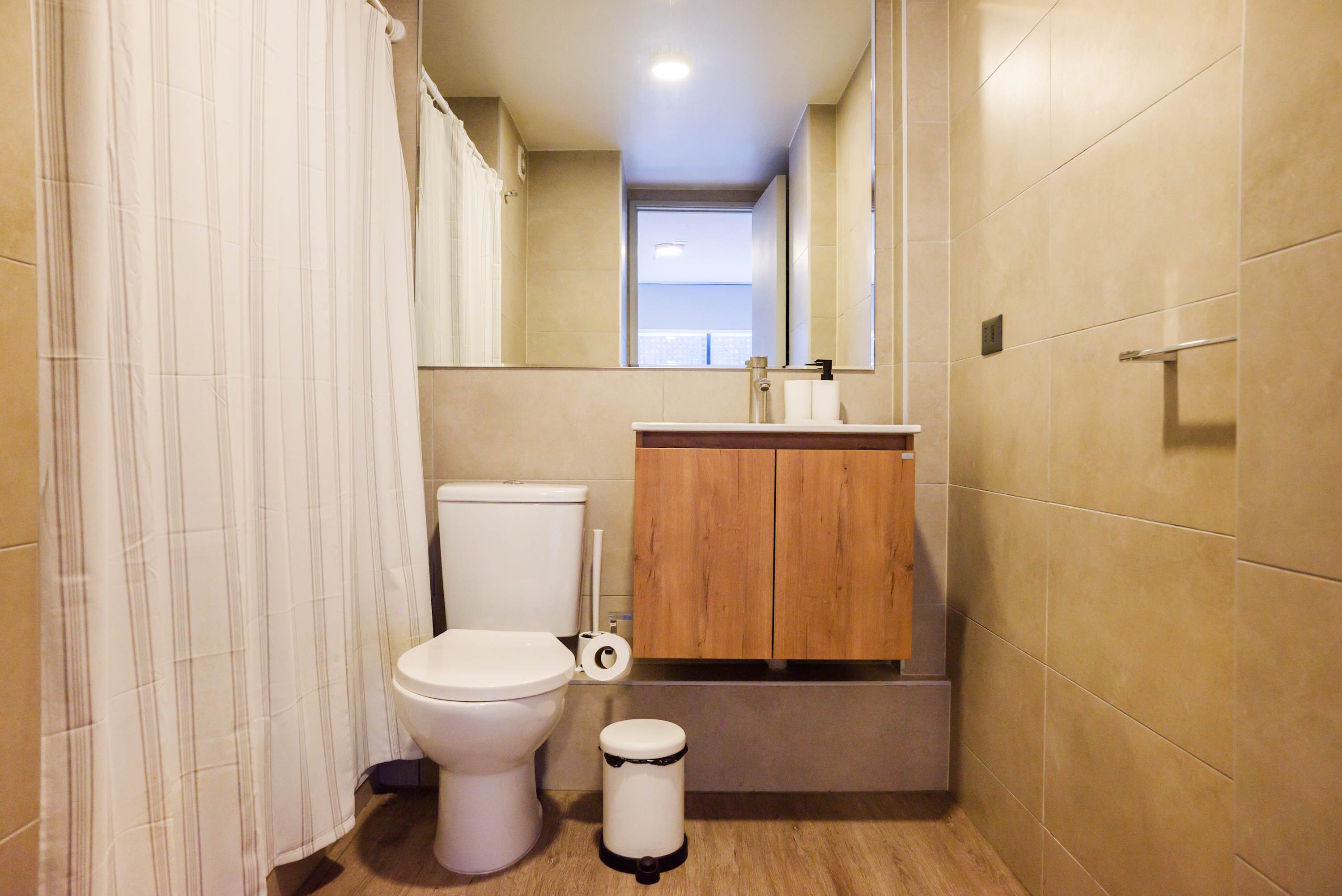 Experience modern comfort in this sleek bathroom with elegant fixtures and a spacious shower.