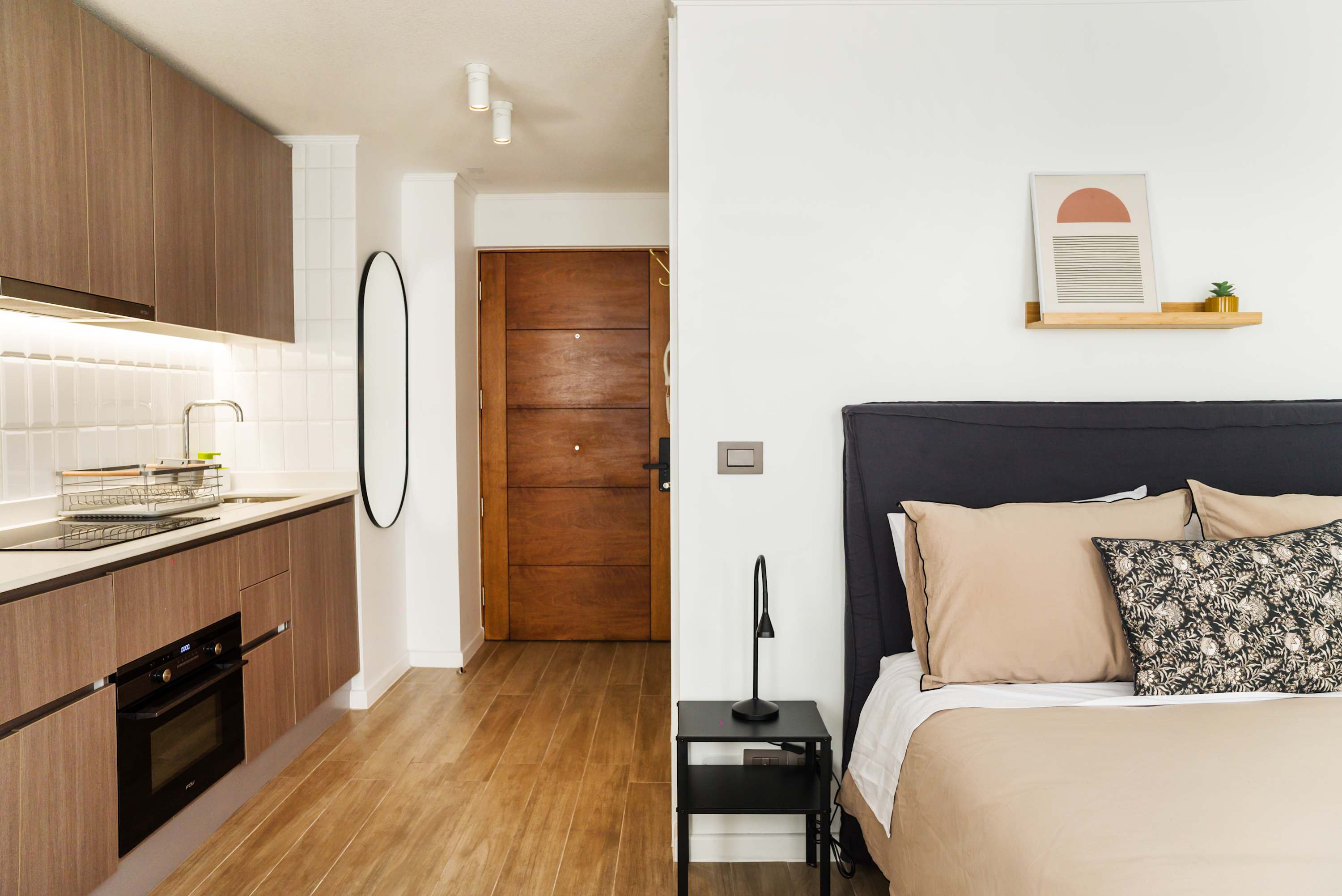 Modern studio with sleek kitchen and cozy sleeping area, perfect for a comfortable stay in the heart of the city.