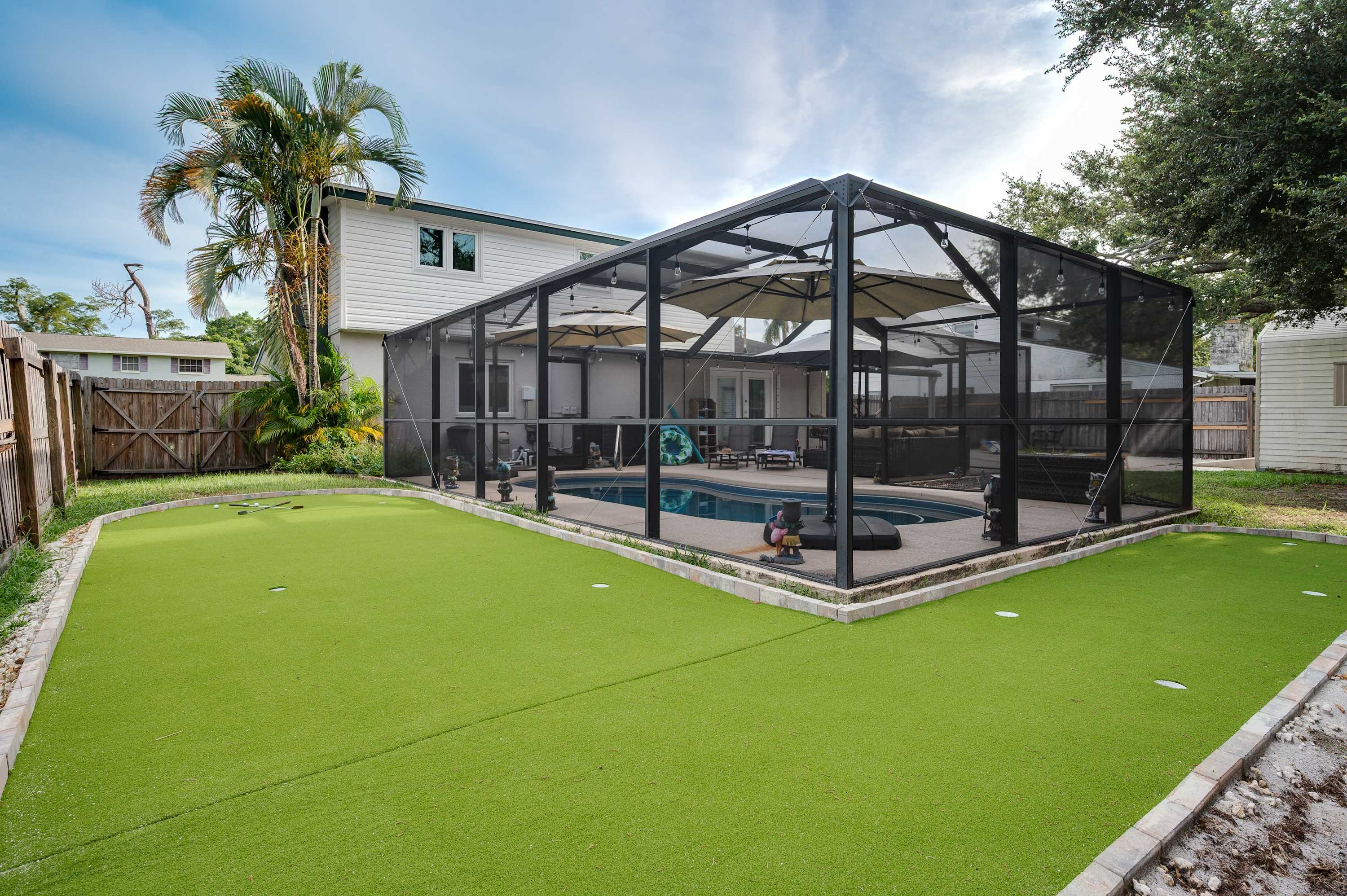 Beyond the pool, discover another fun surprise in the backyard—your very own putting green! This playful amenity adds an extra layer of entertainment to your getaway.