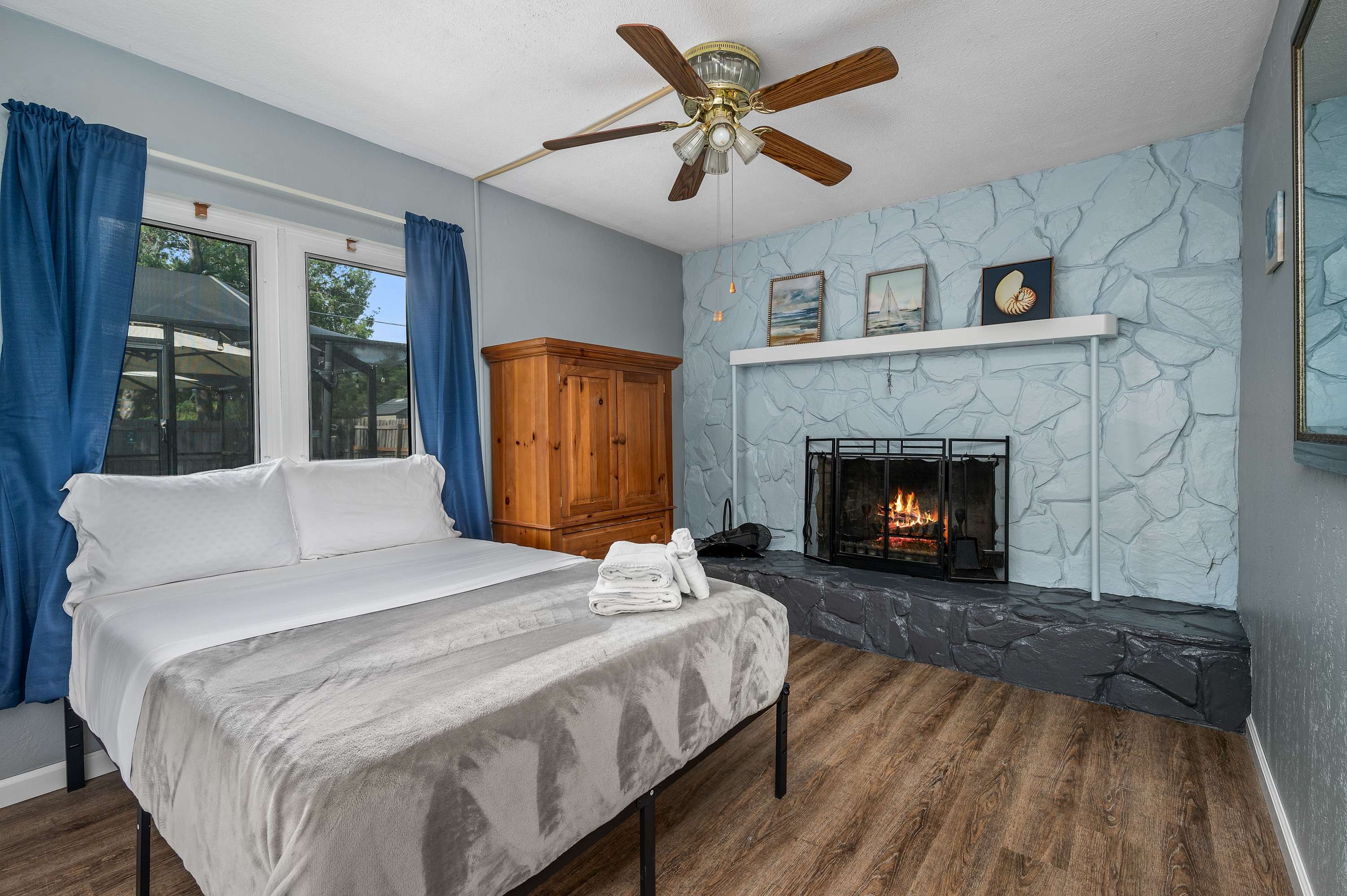 Unwind after a day of adventure in this cozy bedroom sanctuary. The charming fireplace and comfortable bed create the perfect atmosphere for a relaxing evening.