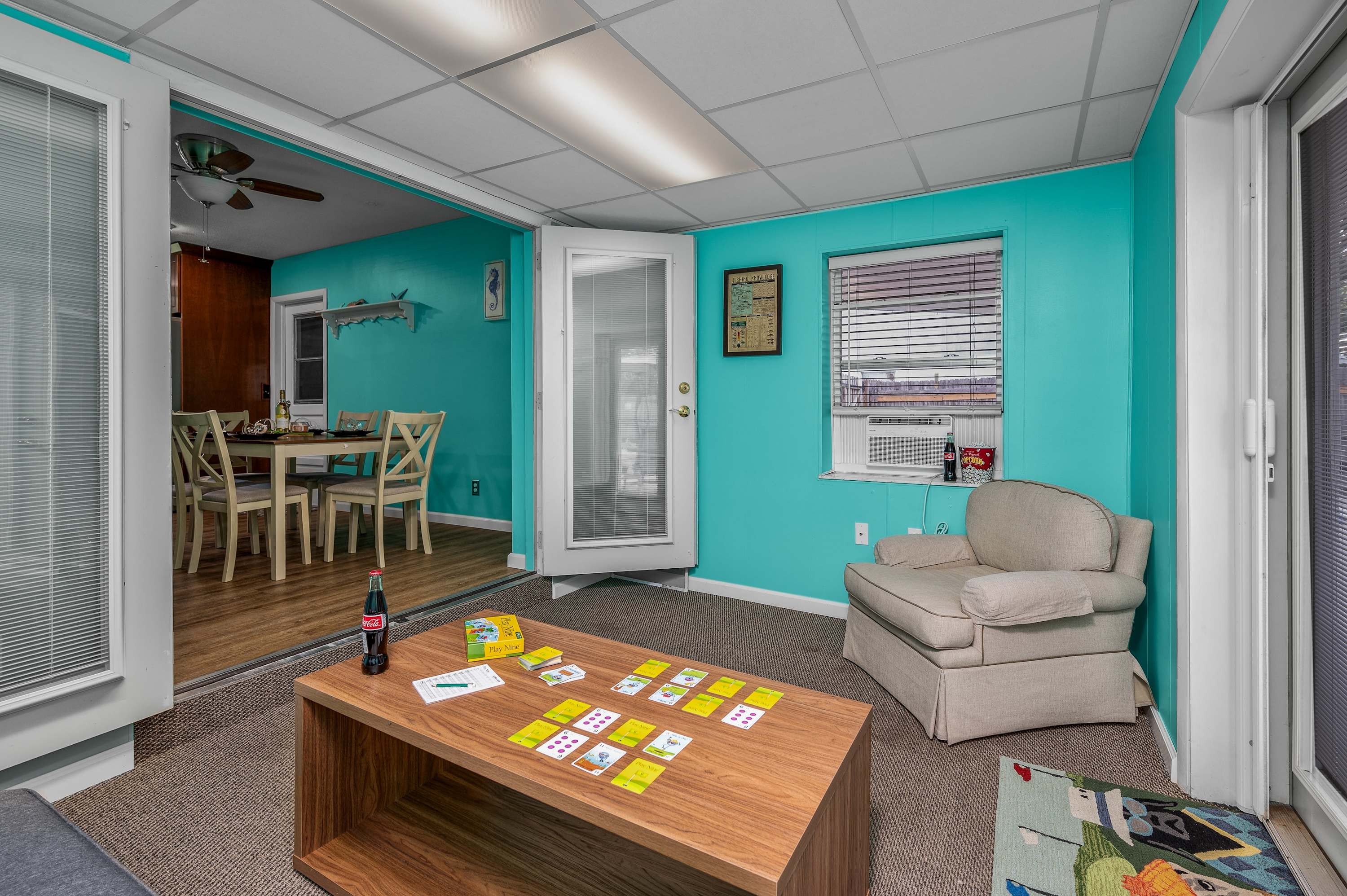 This bright and casual room offers a seamless transition to the outdoor areas, making it a great spot for indoor entertainment and easy access to the Florida sunshine.
