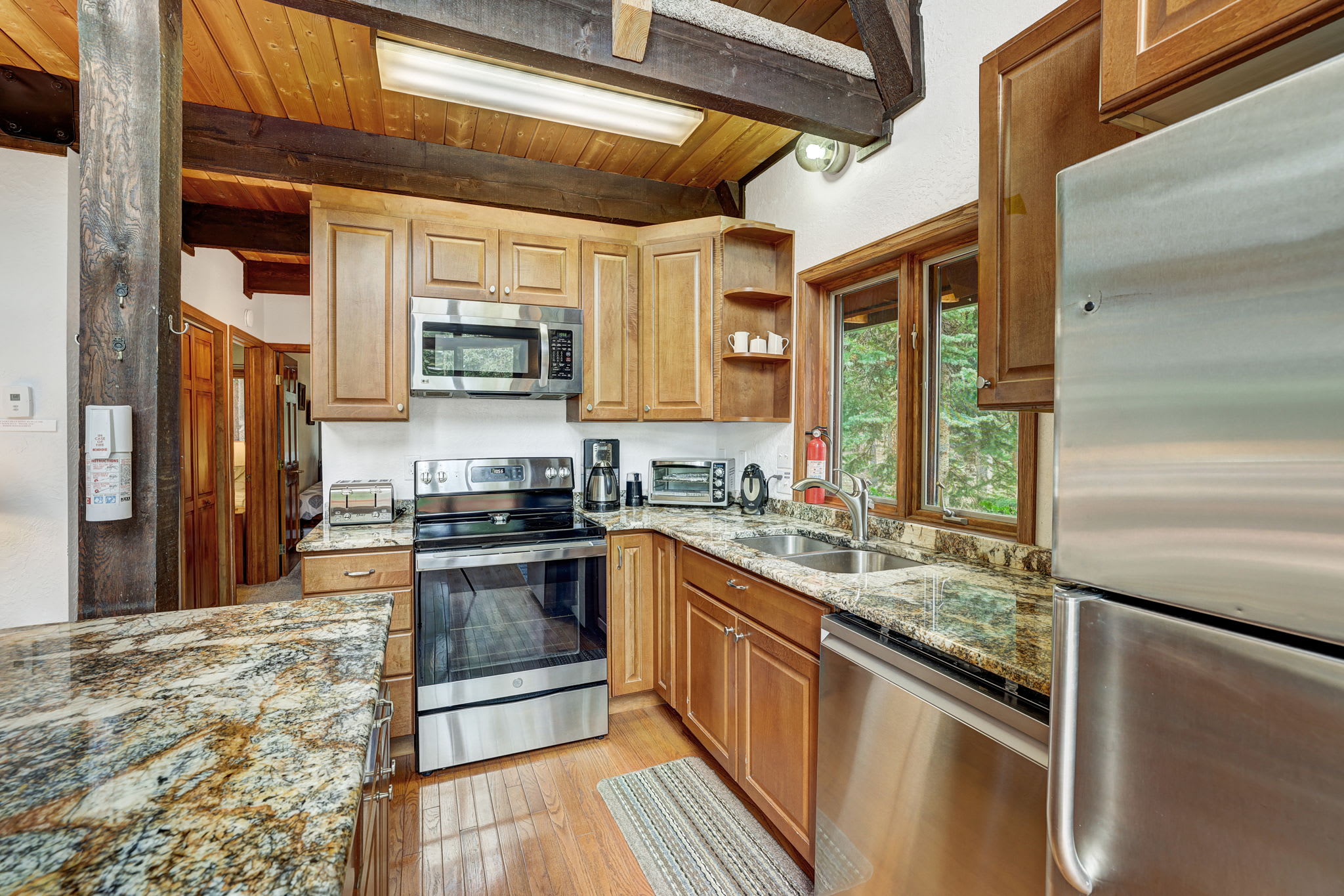 Chef's kitchen with granite counters and stainless appliances 
