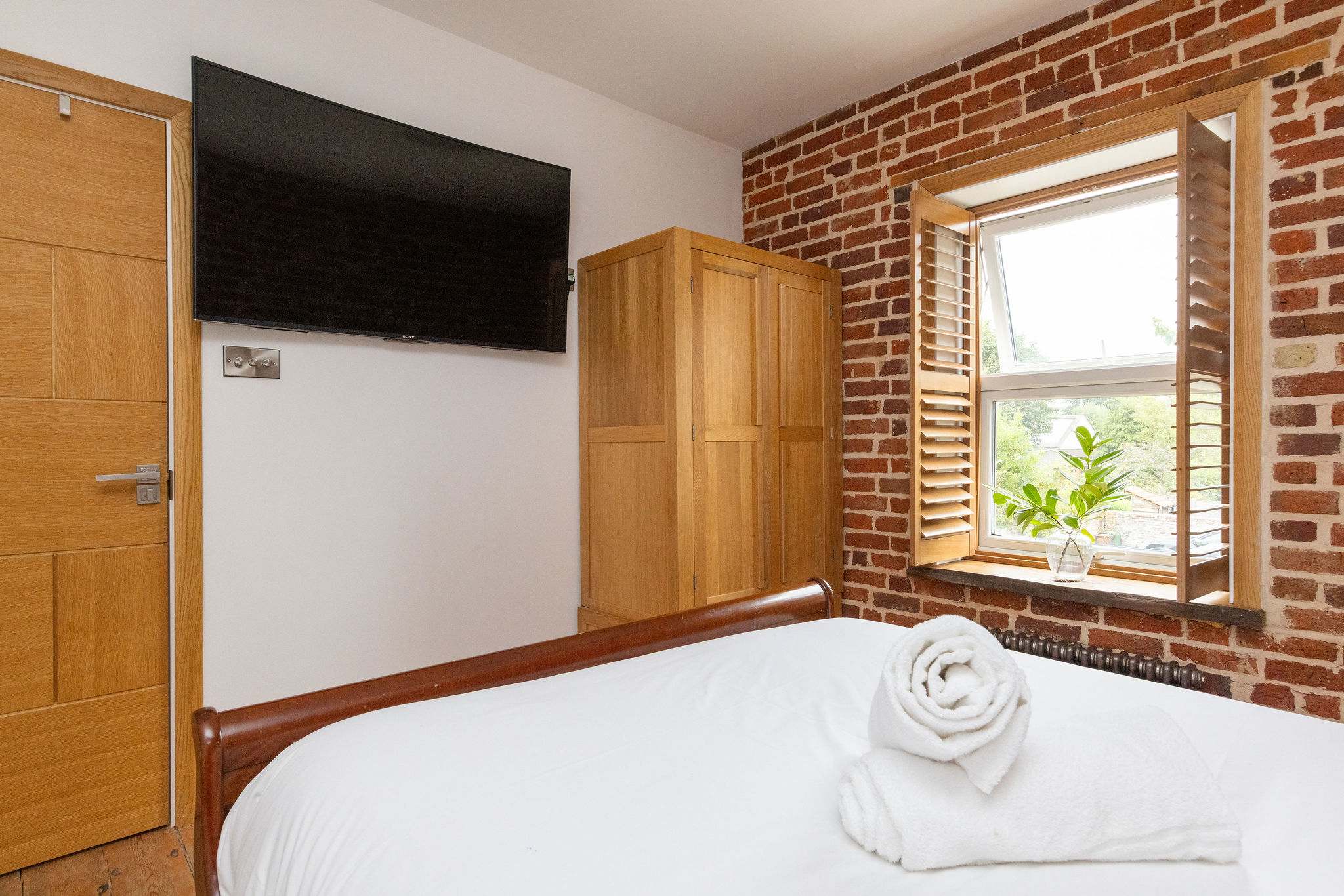Bedroom 2- Another king size bedroom, featuring a wall mounted tv.