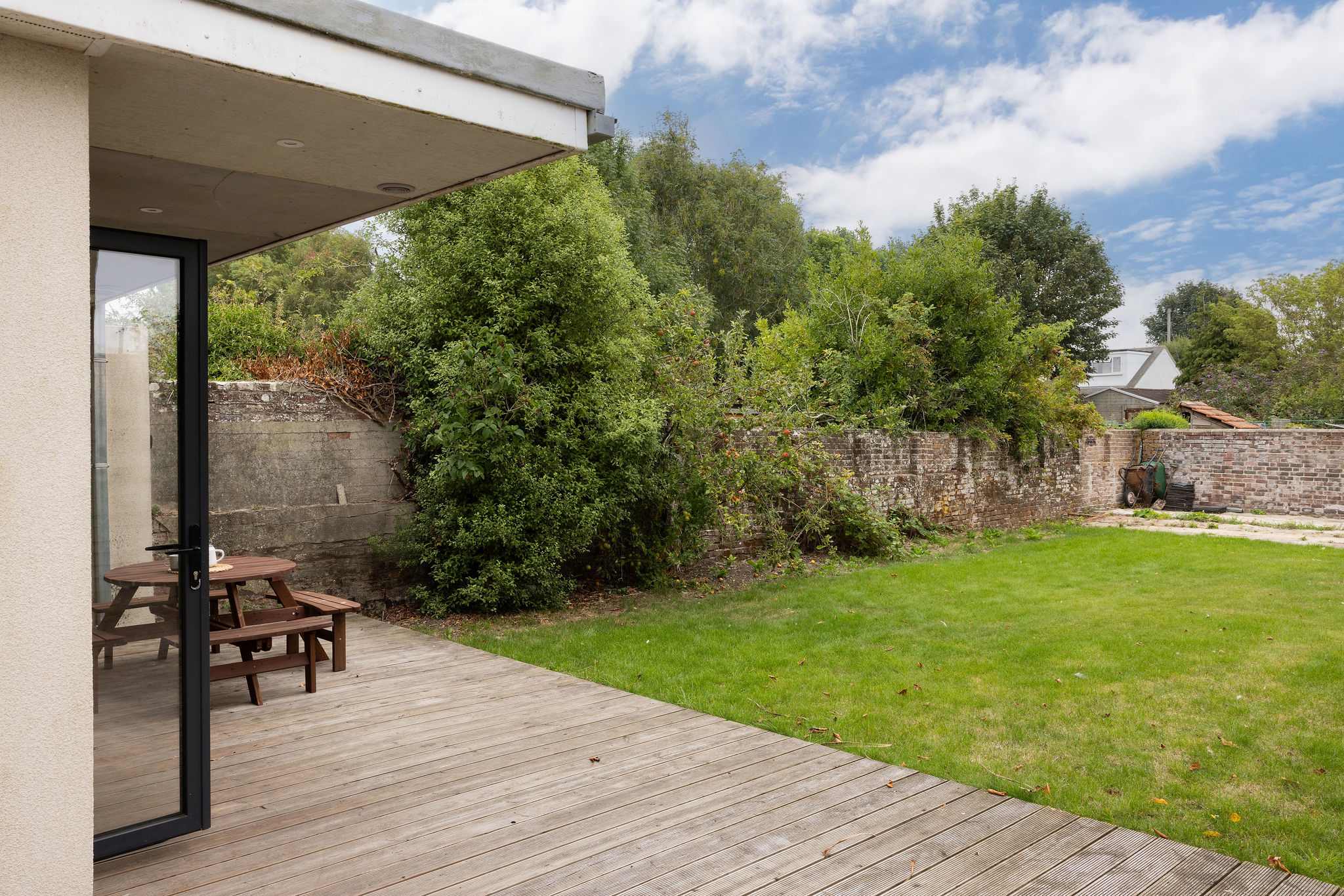 The rear garden has decking and grass to make use of!