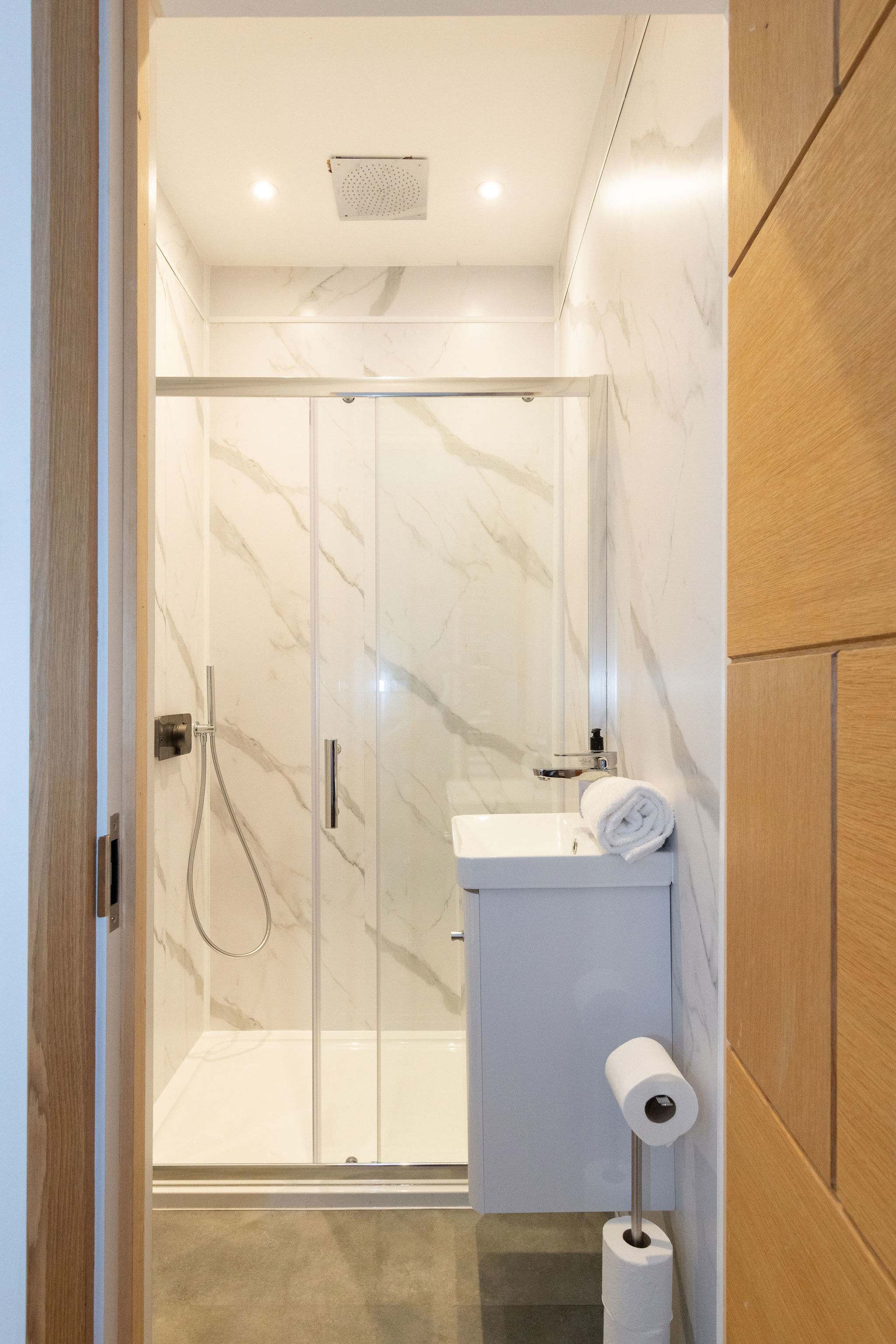 Bedroom 1- A compact shower, sink and wc accompany this bathroom!